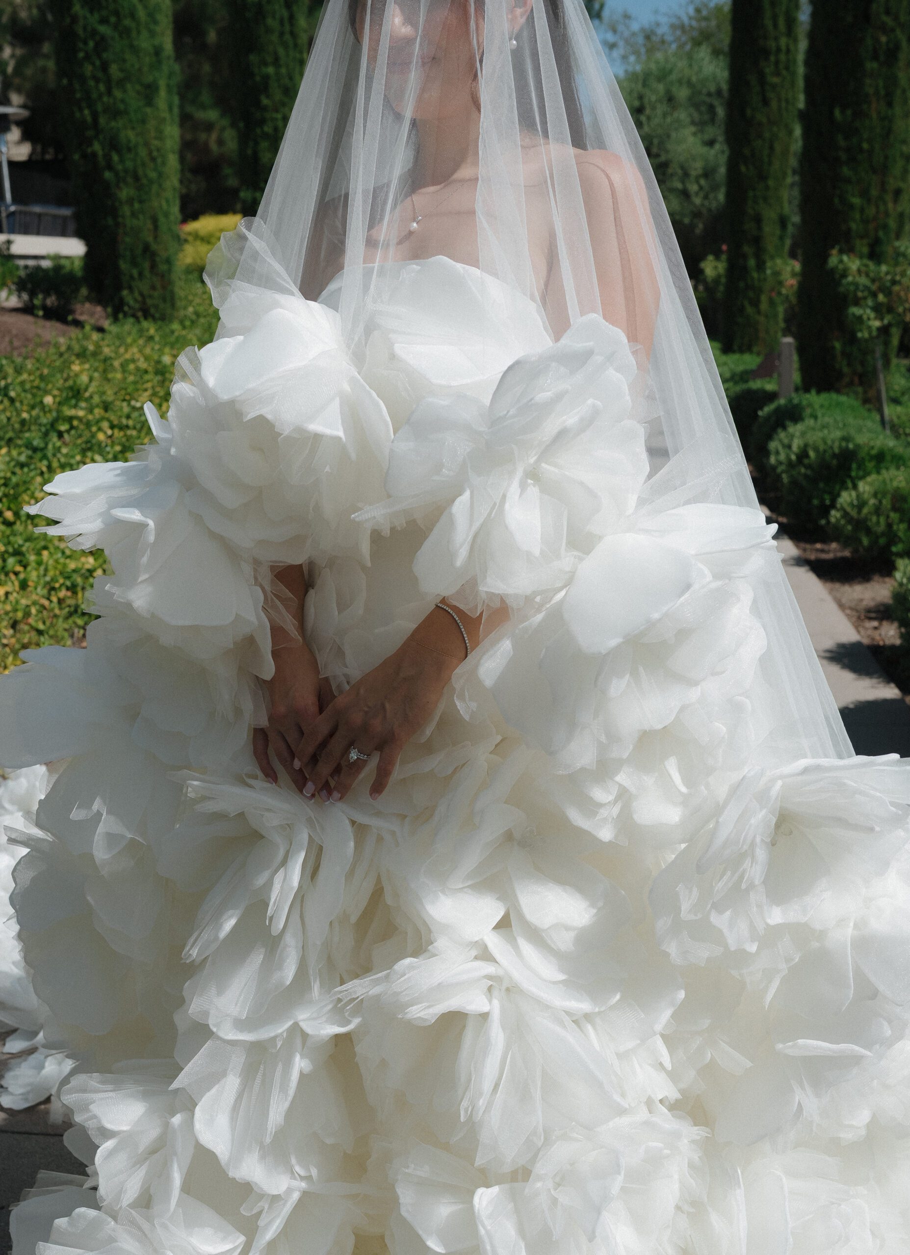 Bridal portrait in a matching ballgown wedding dress and veil with 3D floral appliqués