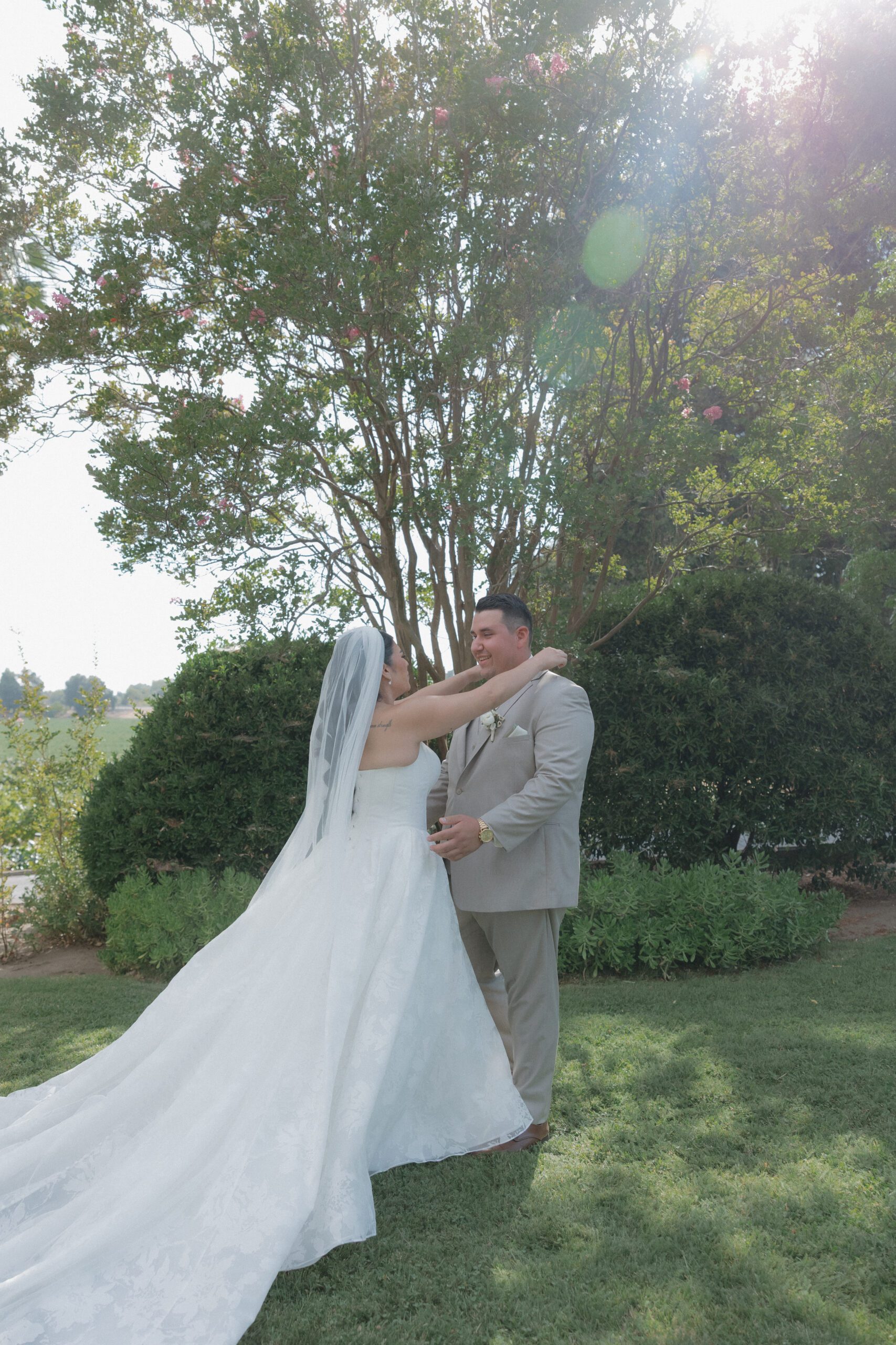 Bride and groom first look photos outdoor on a lawn
