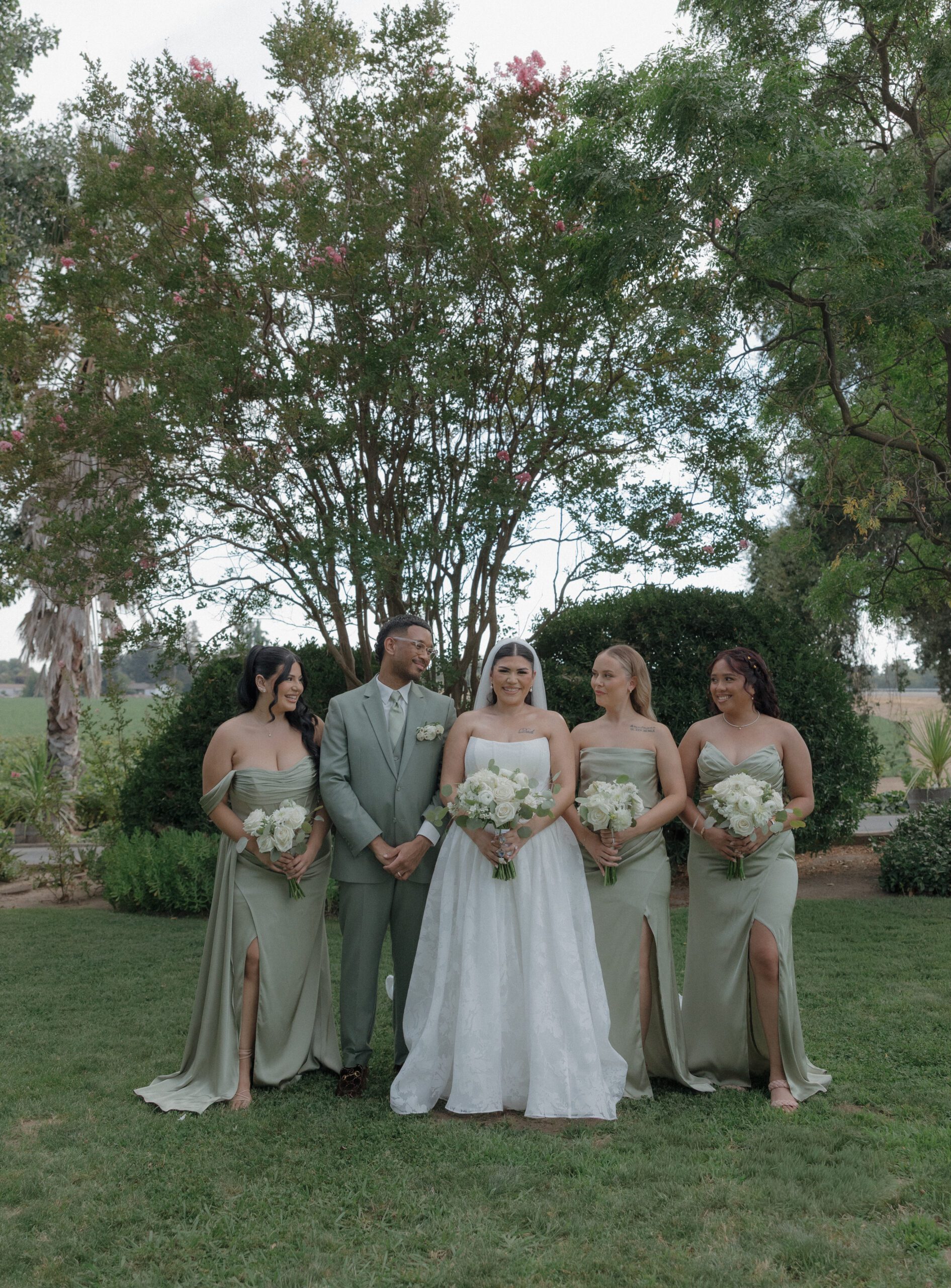 Bride and bridal party photos in sage green bridesmaid dresses
