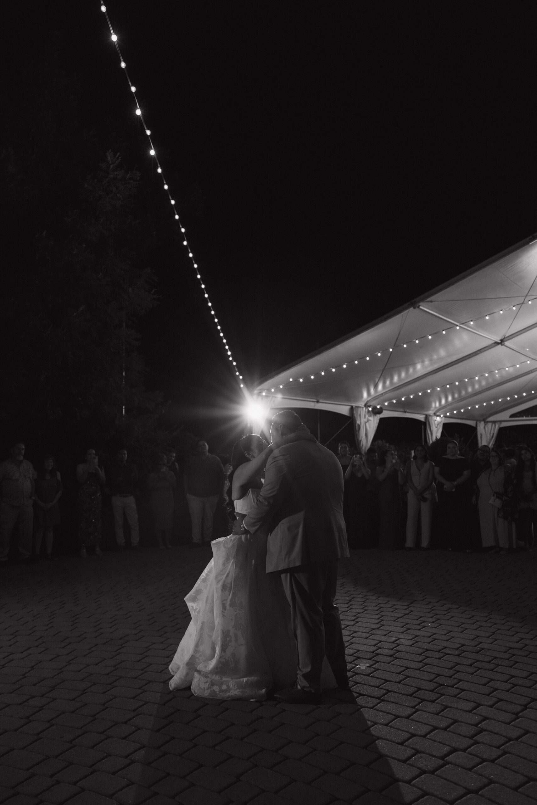 Black and white photo of wedding couple during their first dance