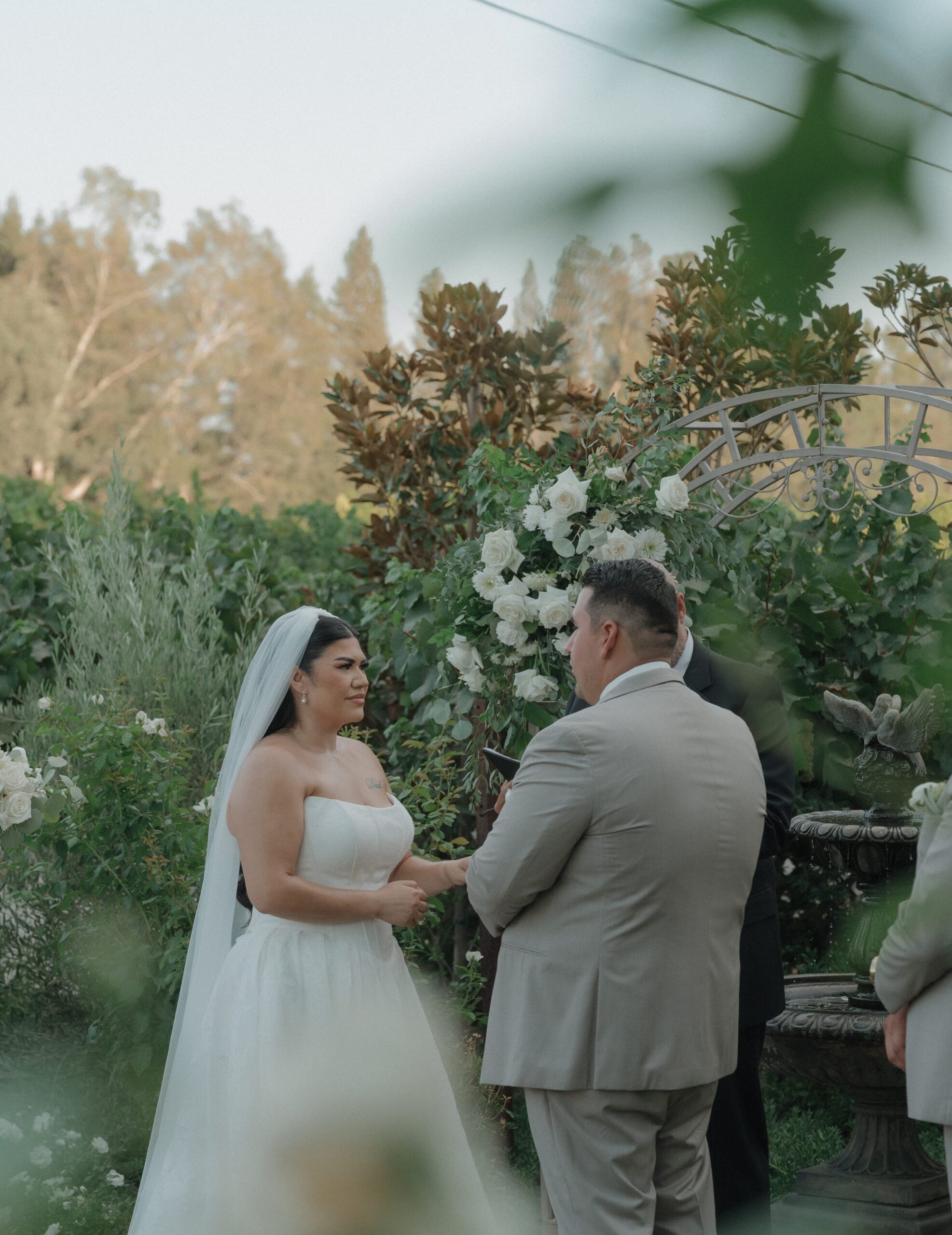 A wedding couple holding hands during their wedding ceremony