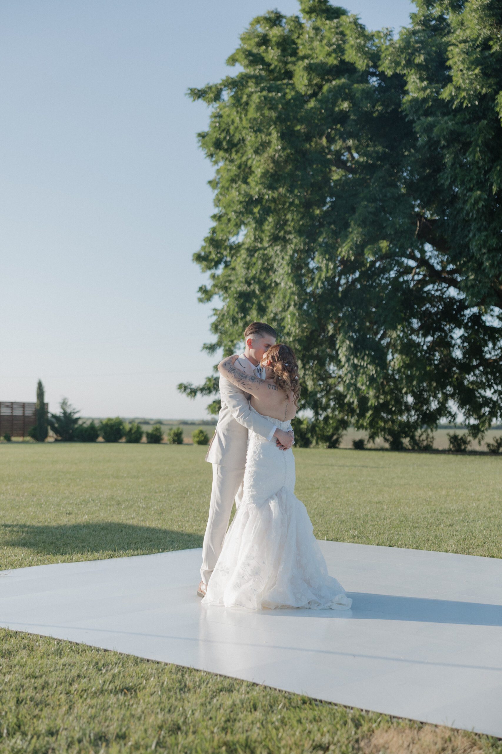 A bride and groom on the dance floor sharing their first dance