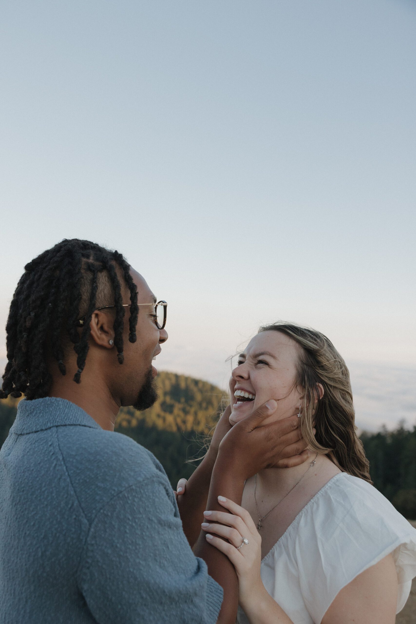 A couple laughing during engagement photos at Mt. Tamalpais