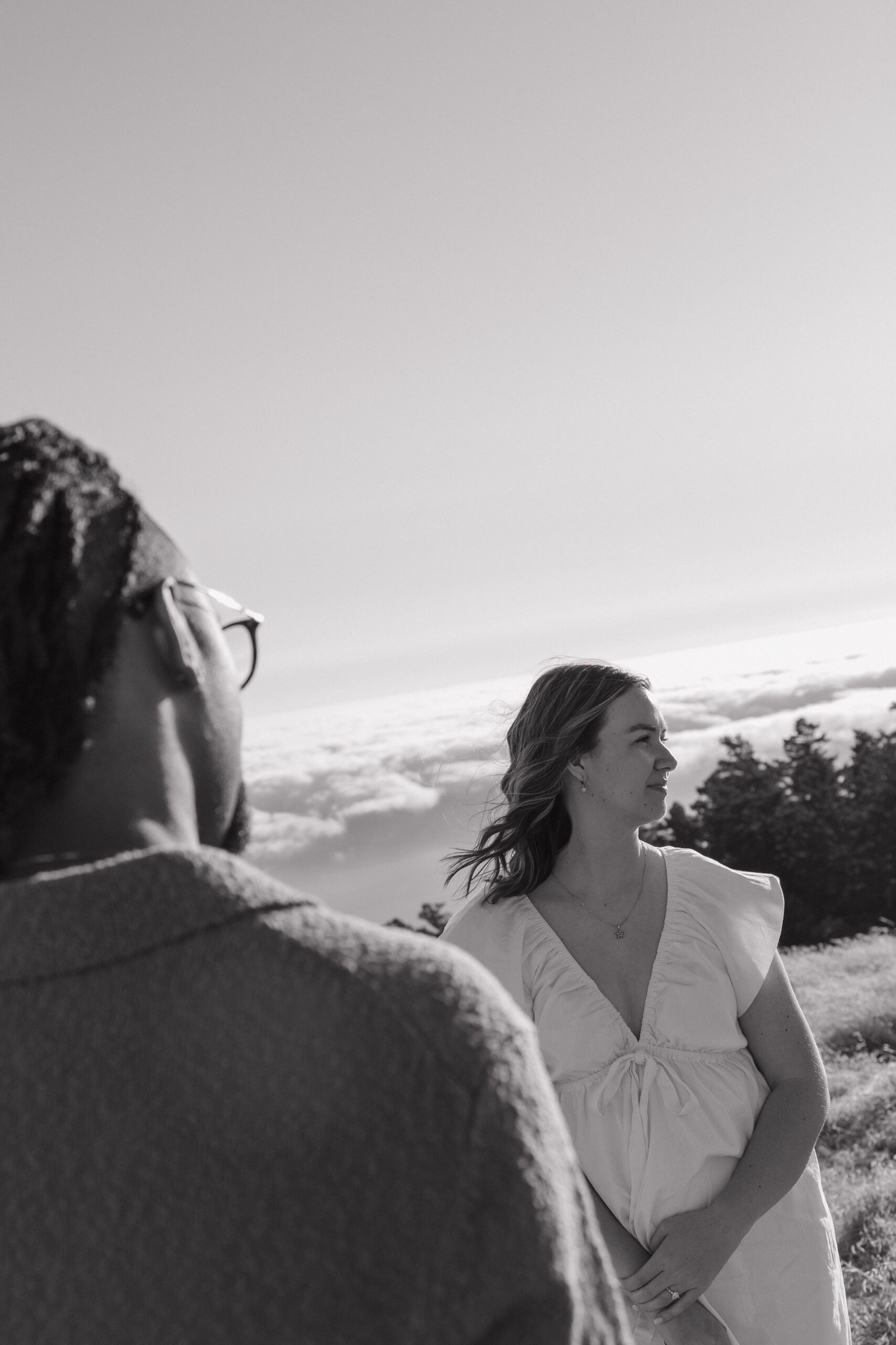 A couple looking in opposite directions at Mt. Tamalpais engagement photoshoot