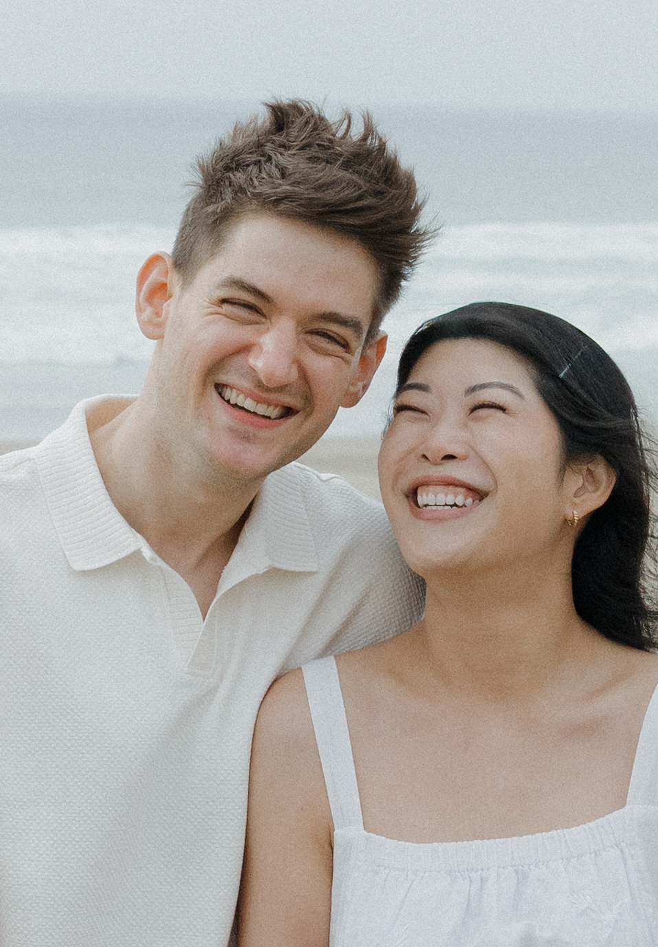 Couple laughing during candid engagement photo