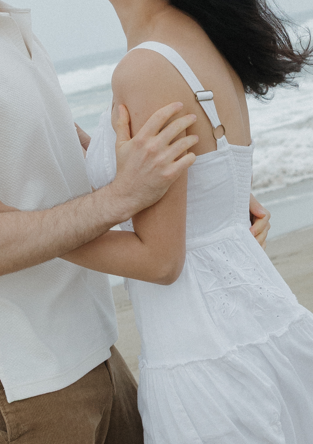 An editorial engagement photo on the beach