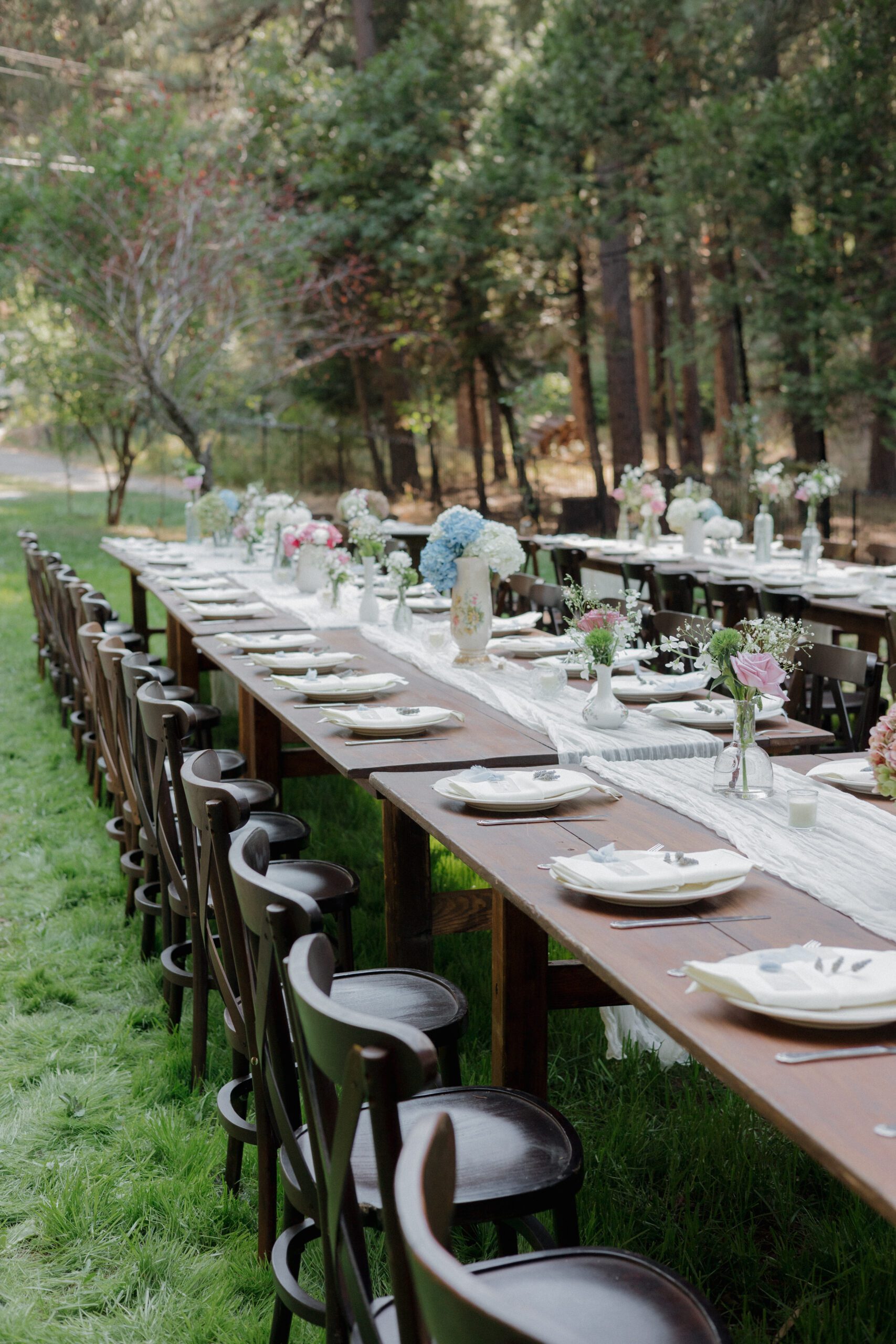 Long wedding ables setup outdoors for an intimate wedding