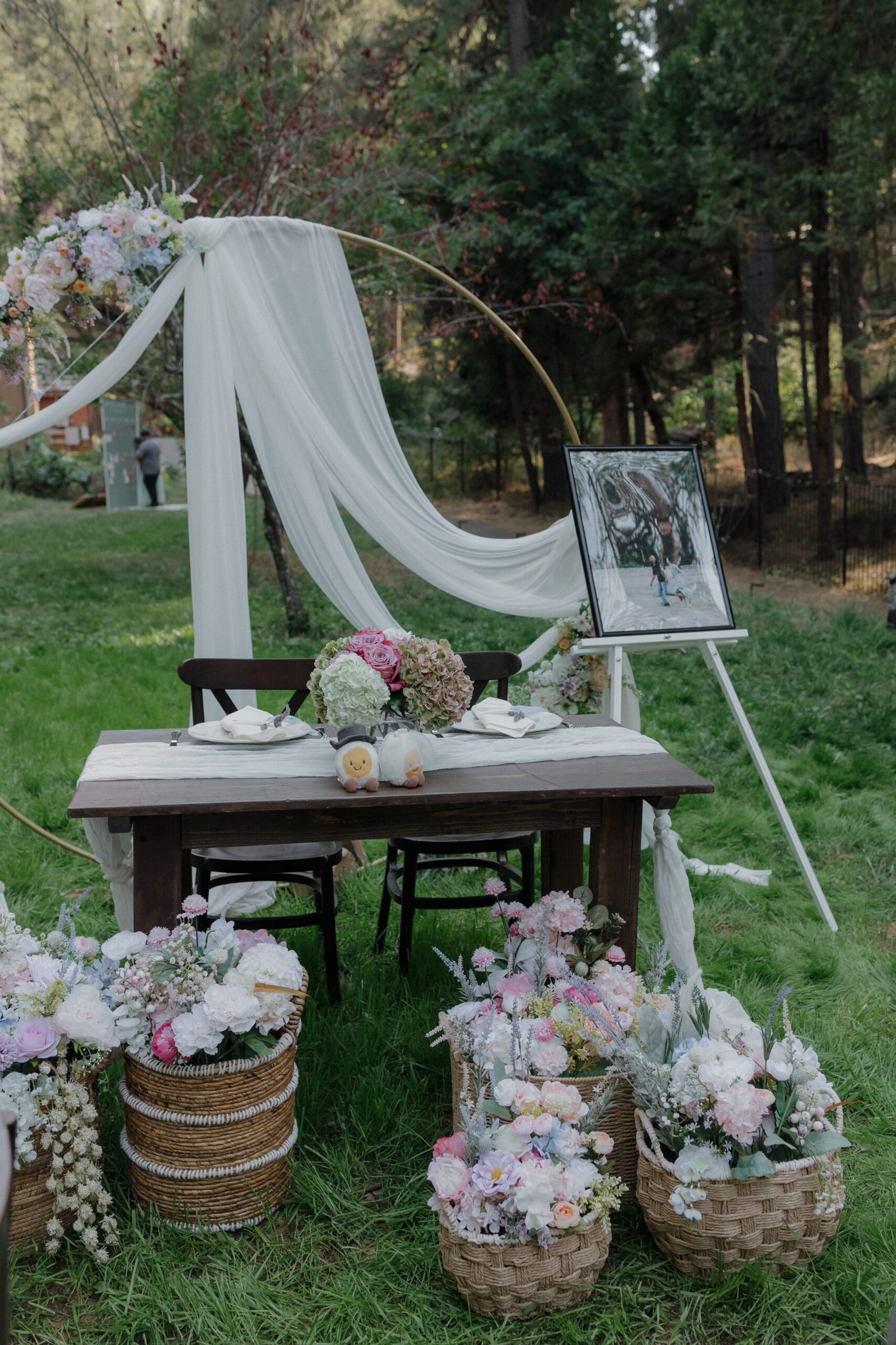 A wedding sweetheart table setup with pastel wedding flowers