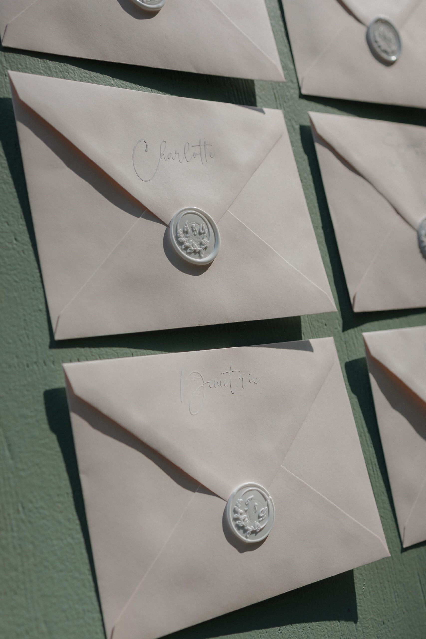 Handwritten notes to every guest as a wedding seating chart for an intimate wedding