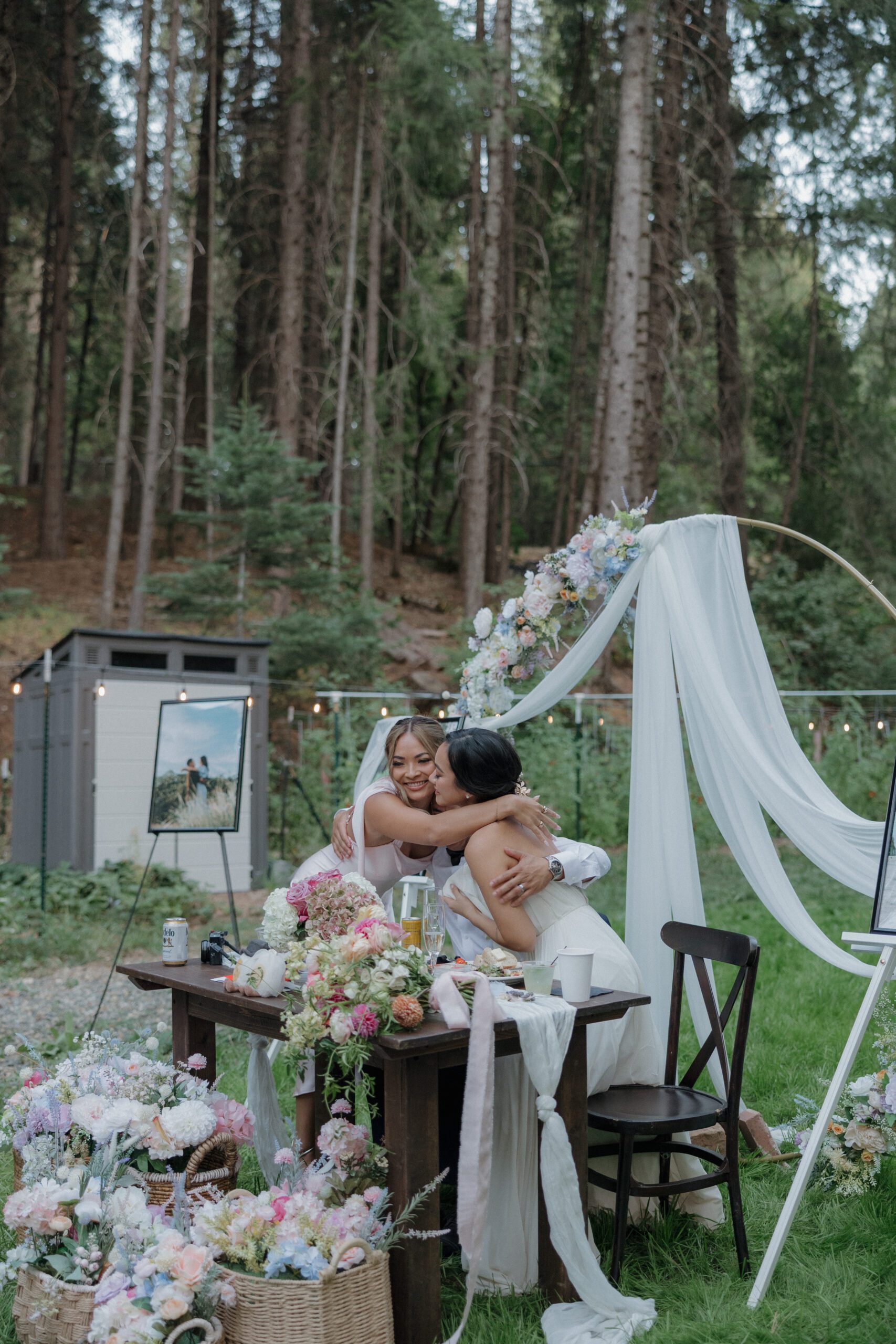 A bridesmaid hugging the bride after giving her toast at an intimate wedding