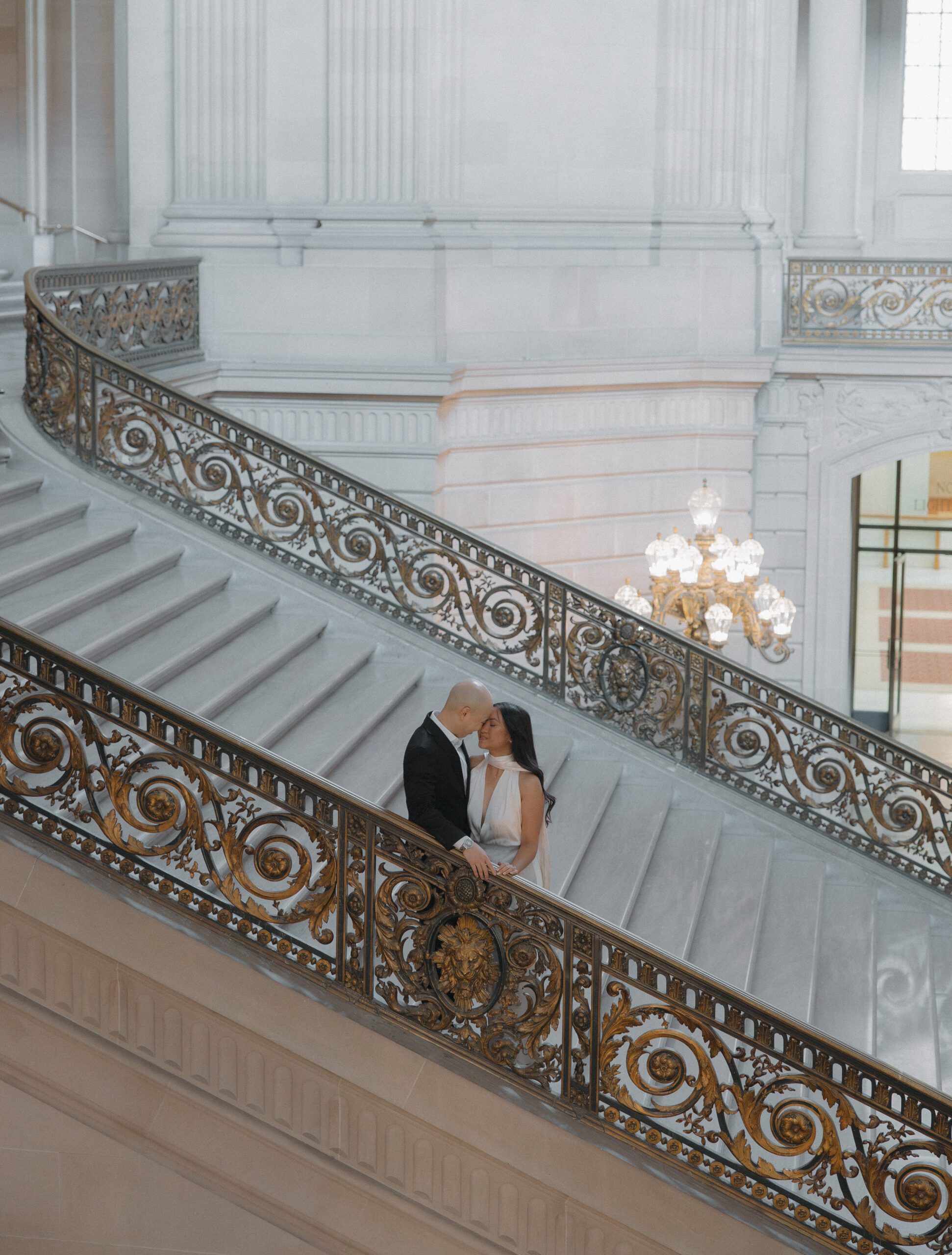 A couple on the Grand Staircase at San Francisco City Hall