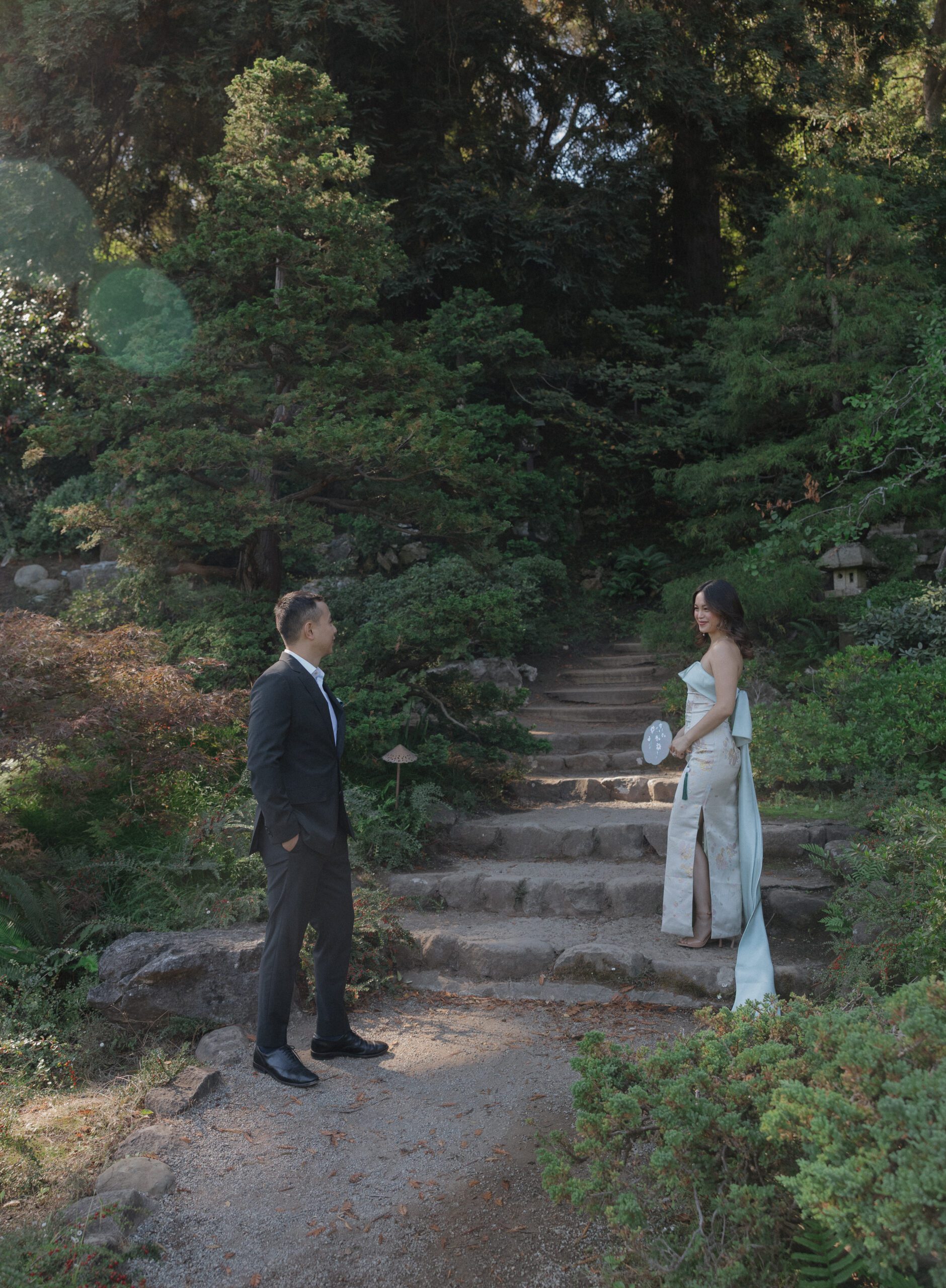 A couple standing apart from each other for an engagement photo pose