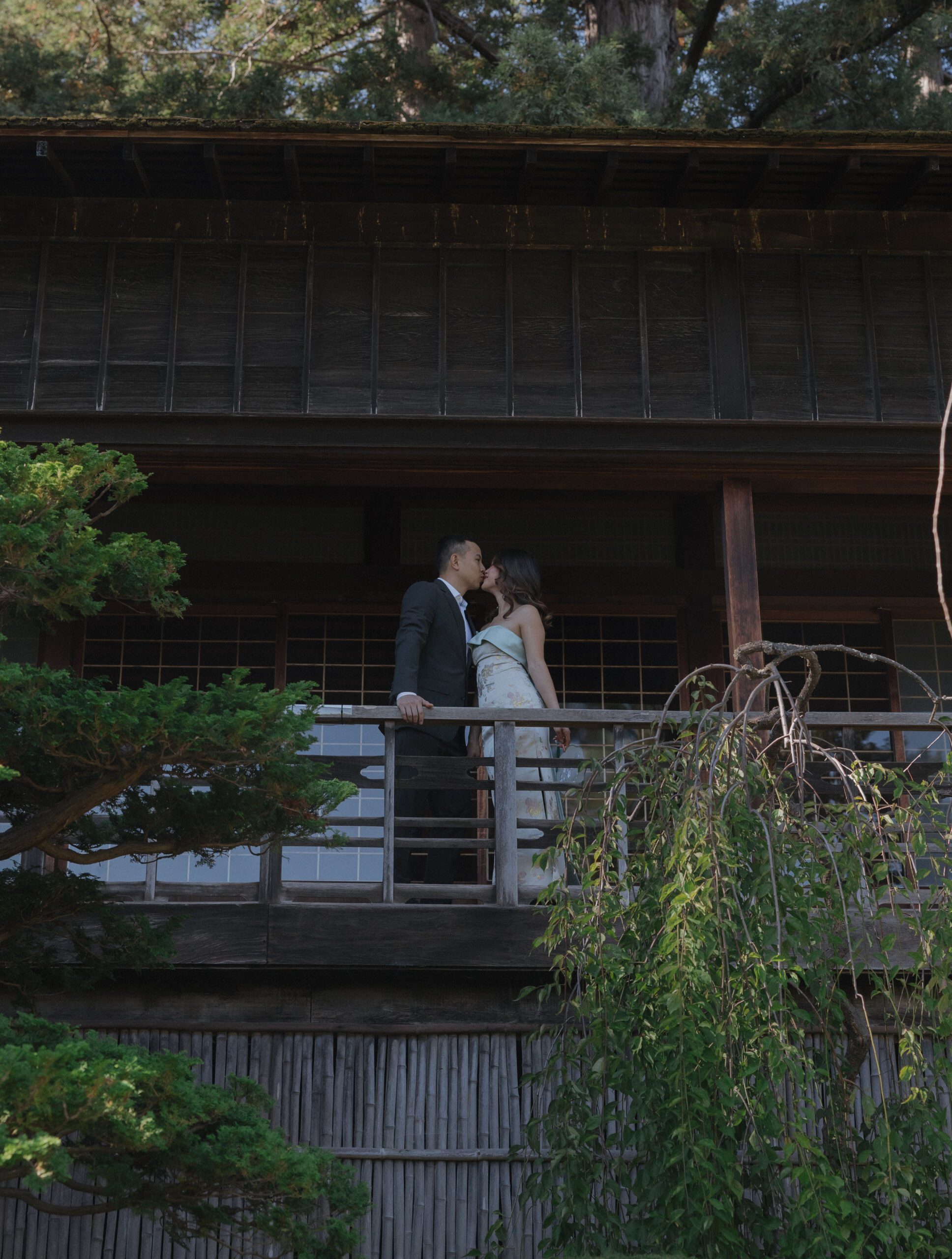 A couple kissing at the Moon Viewing house at Hakone Estate and Gardens