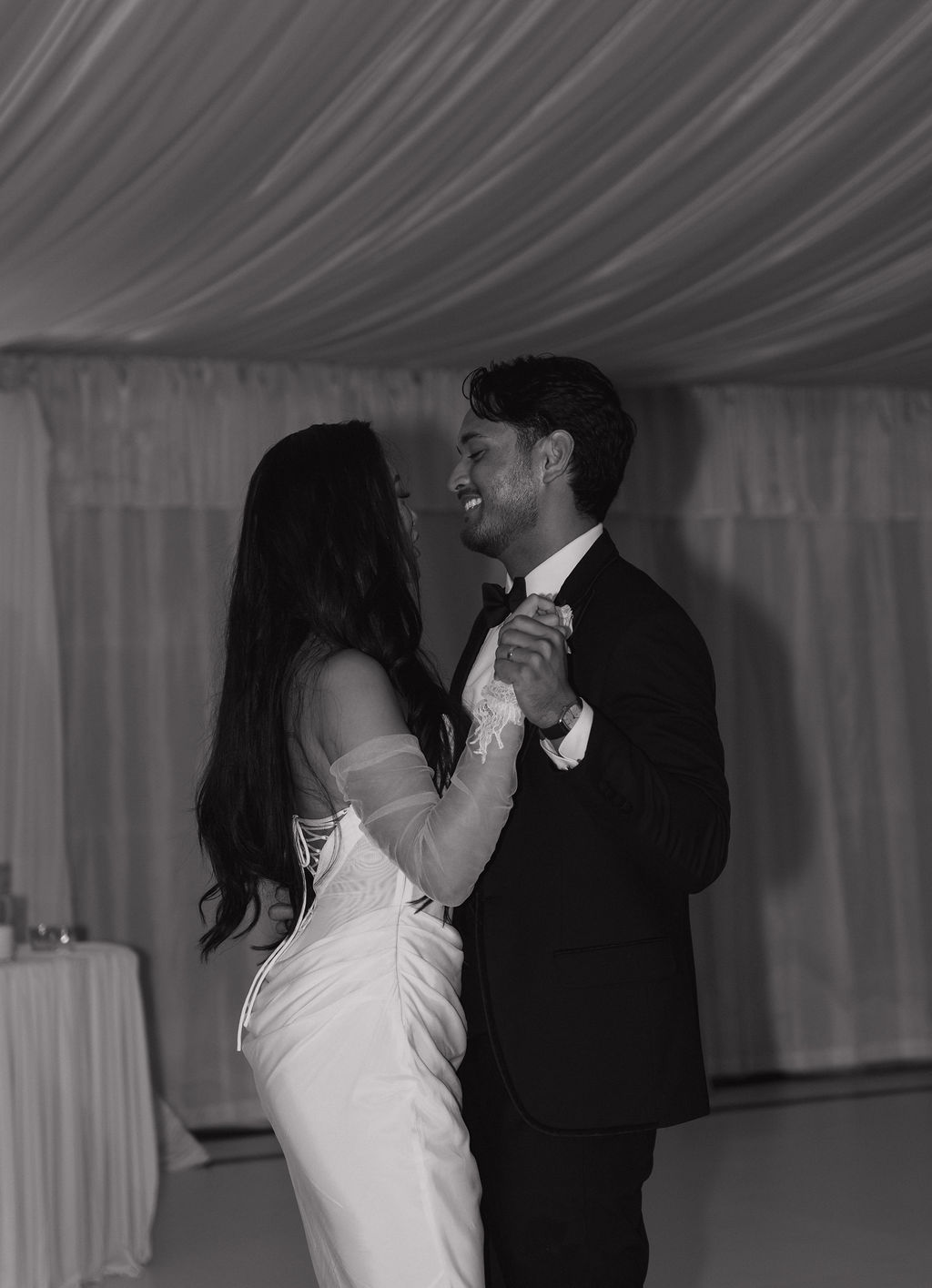 A bride and groom dancing at their grand island mansion wedding reception