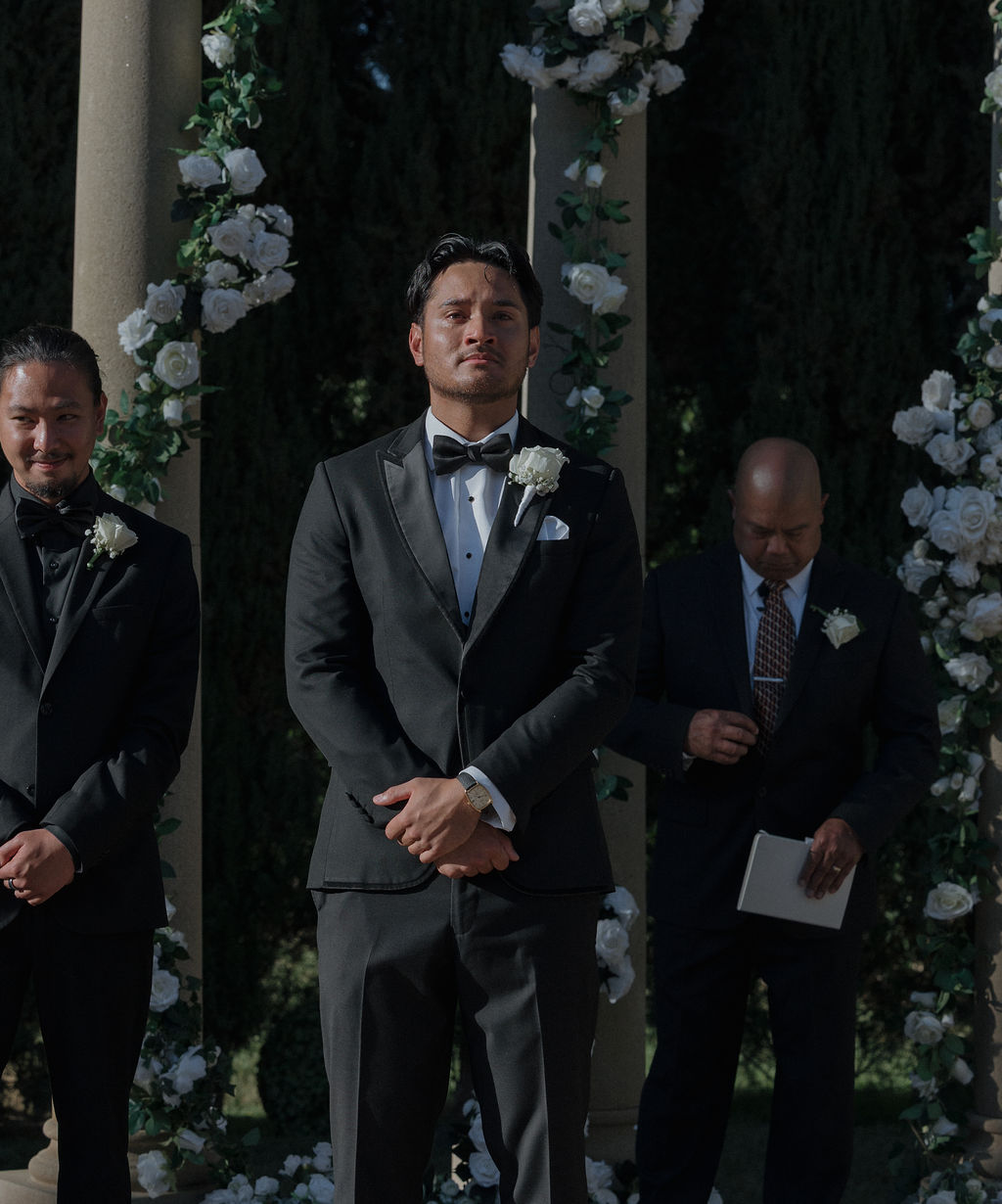 A groom's reaction to a bride walking down the aisle