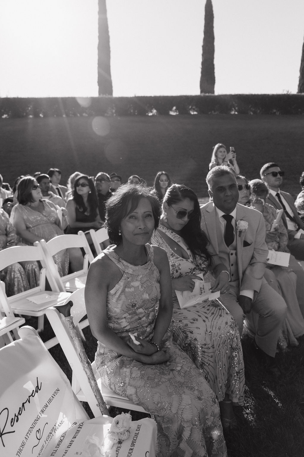 A mother crying watching a wedding ceremony