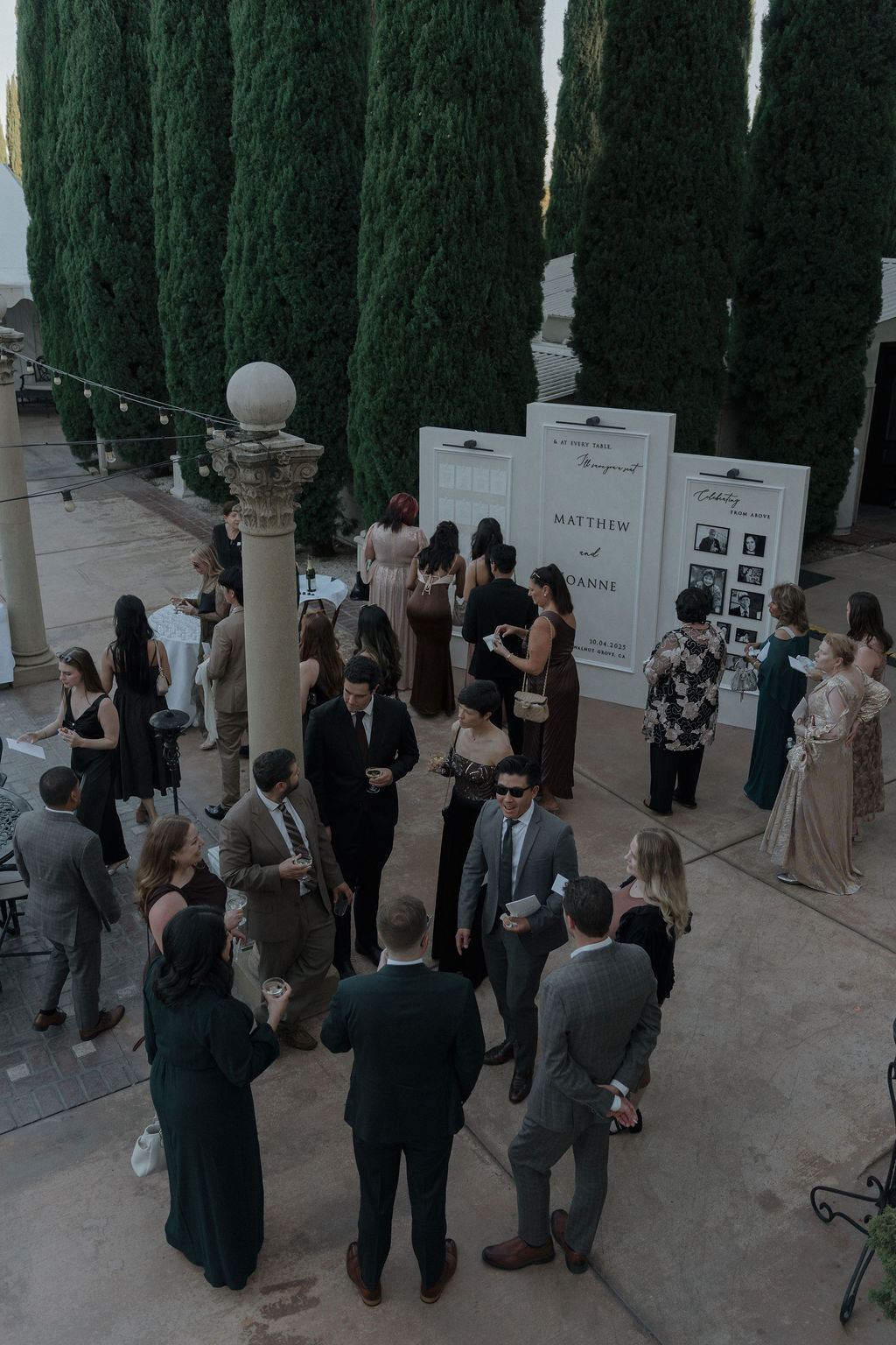 Wedding guests at a cocktail hour at grand island mansion