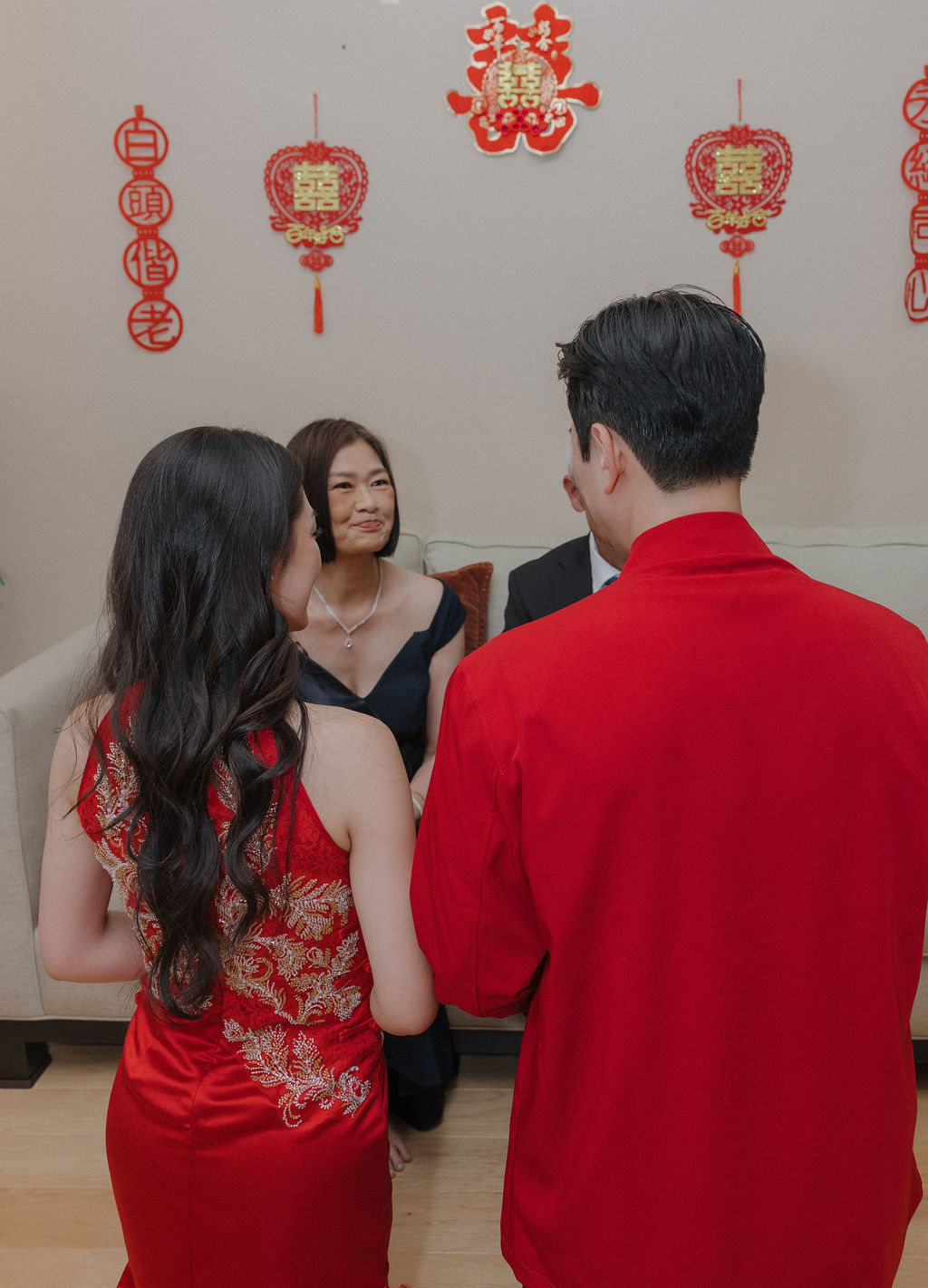 A wedding couple receiving tea for their tea ceremony