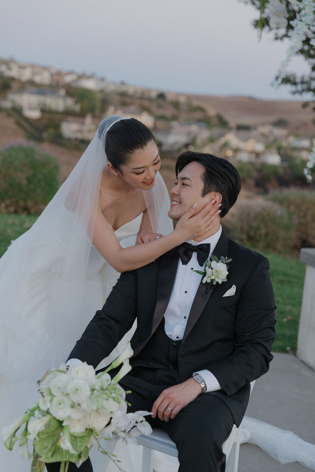 A bride and groom leaning in for a kiss at their California wedding venue, the ranch at silver creek