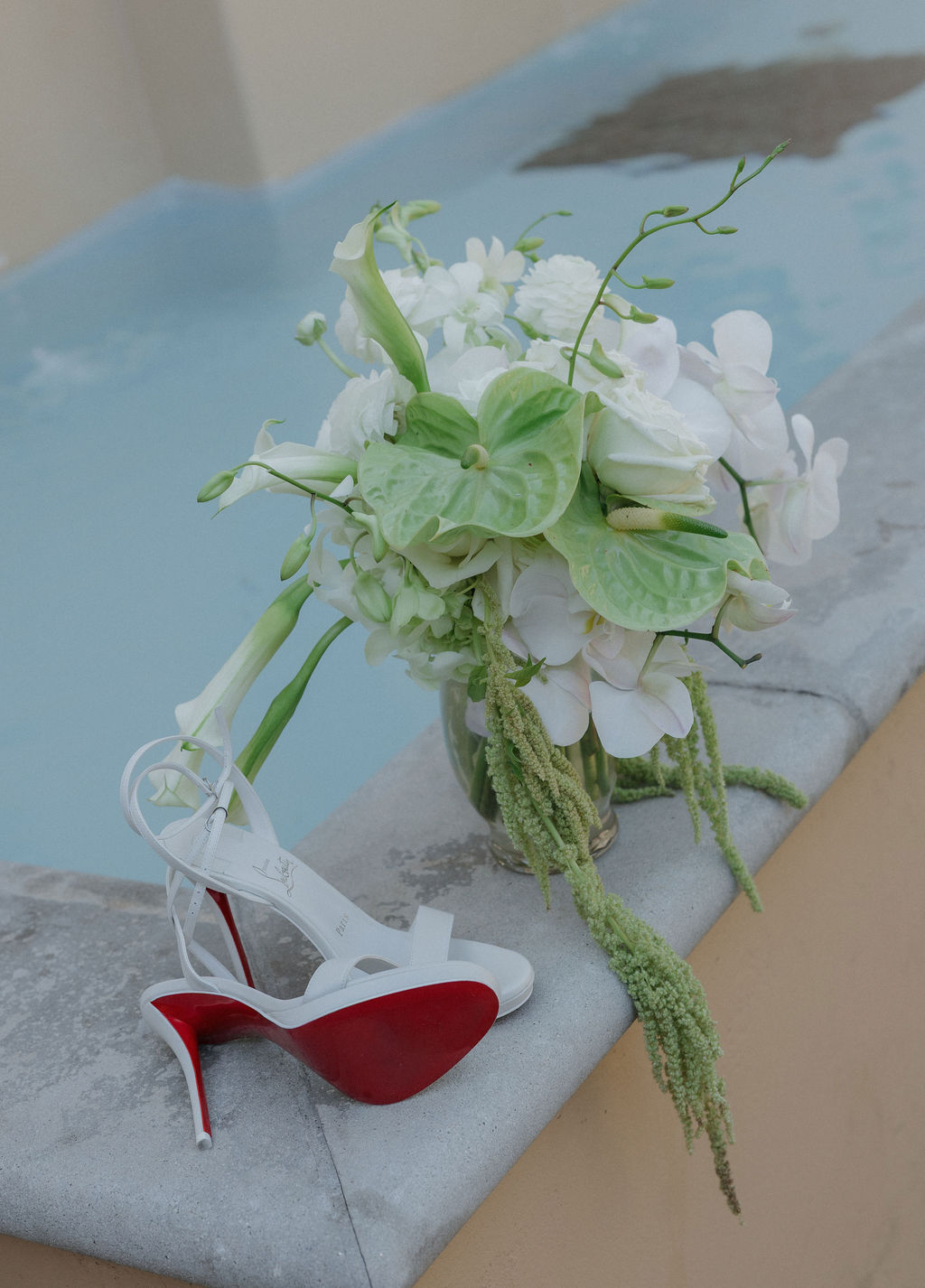 Luxury wedding ideas: Louboutin wedding shoes and a lily wedding bouquet 