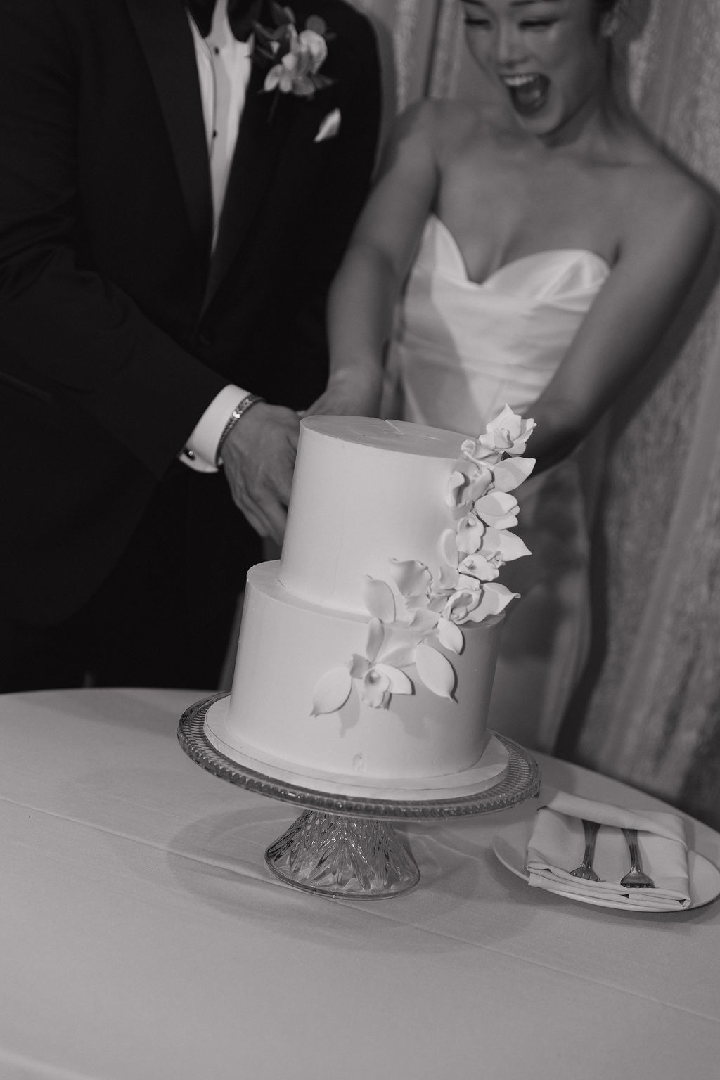 A bride and groom cutting their luxury wedding cake, for luxury wedding ideas