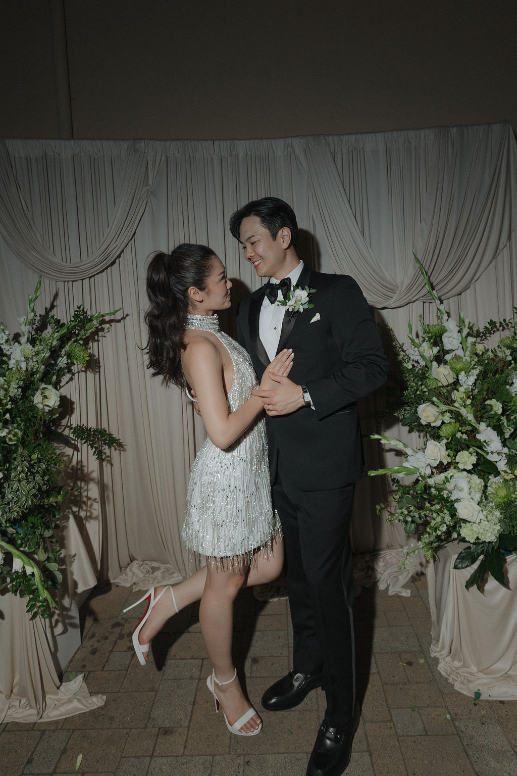 A bride and groom surrounded by luxury wedding ideas in a photo from their wedding reception