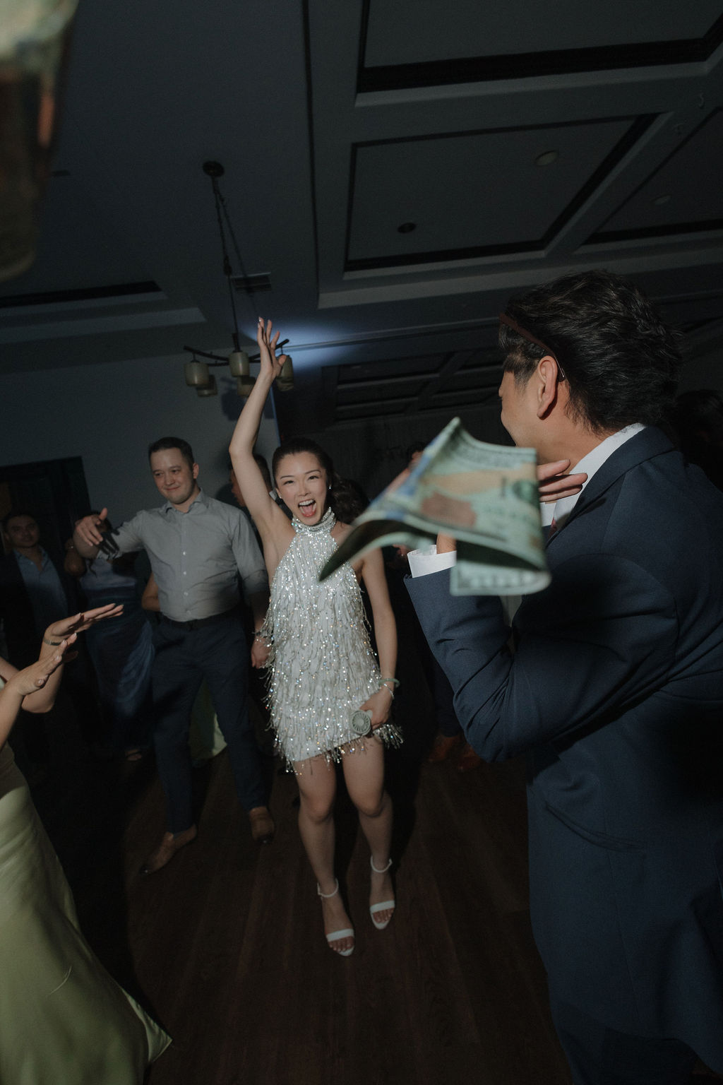 A bride laughing during her wedding reception
