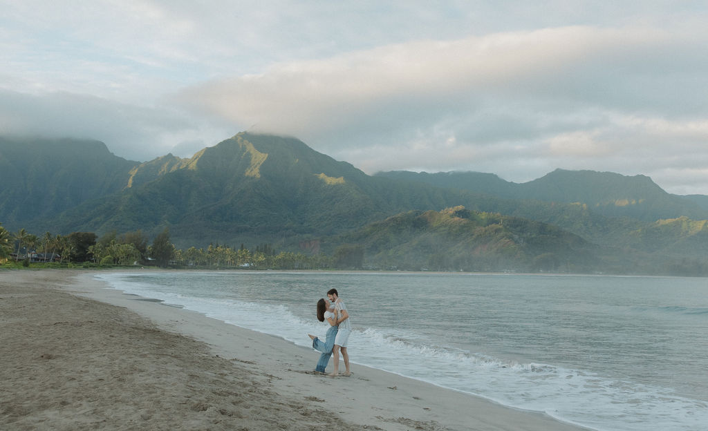 A couple on Hanalei Bay at sunset