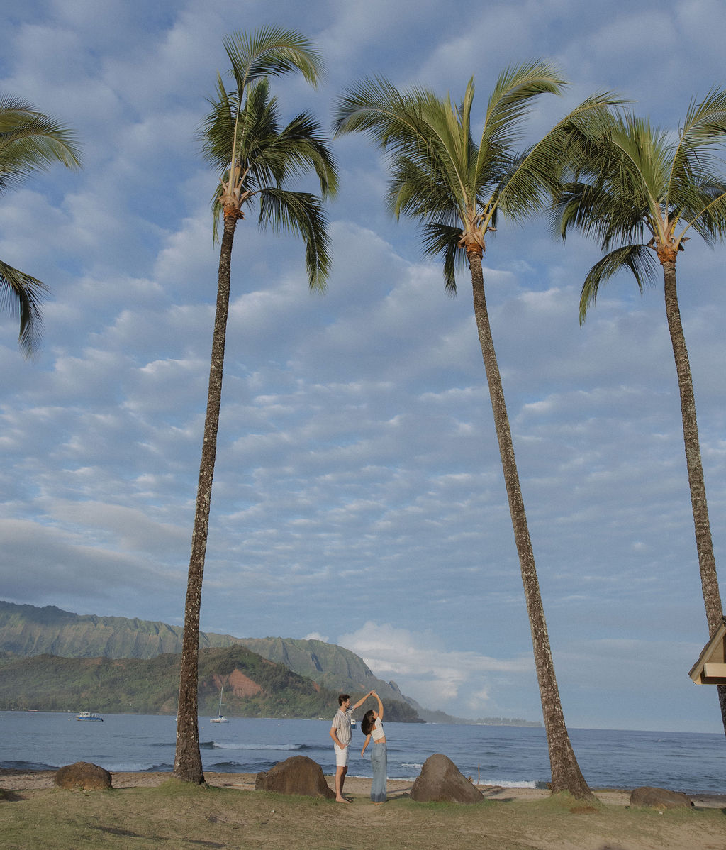 A couple dancing during Hanalei Bay engagement photos