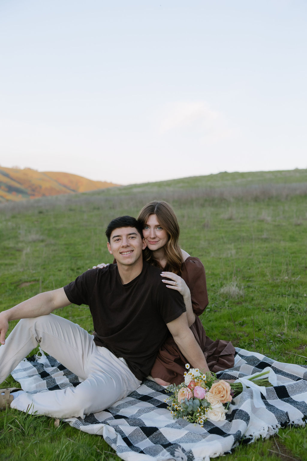 A couple posing for engagement photos in an El Dorado Hills engagement session