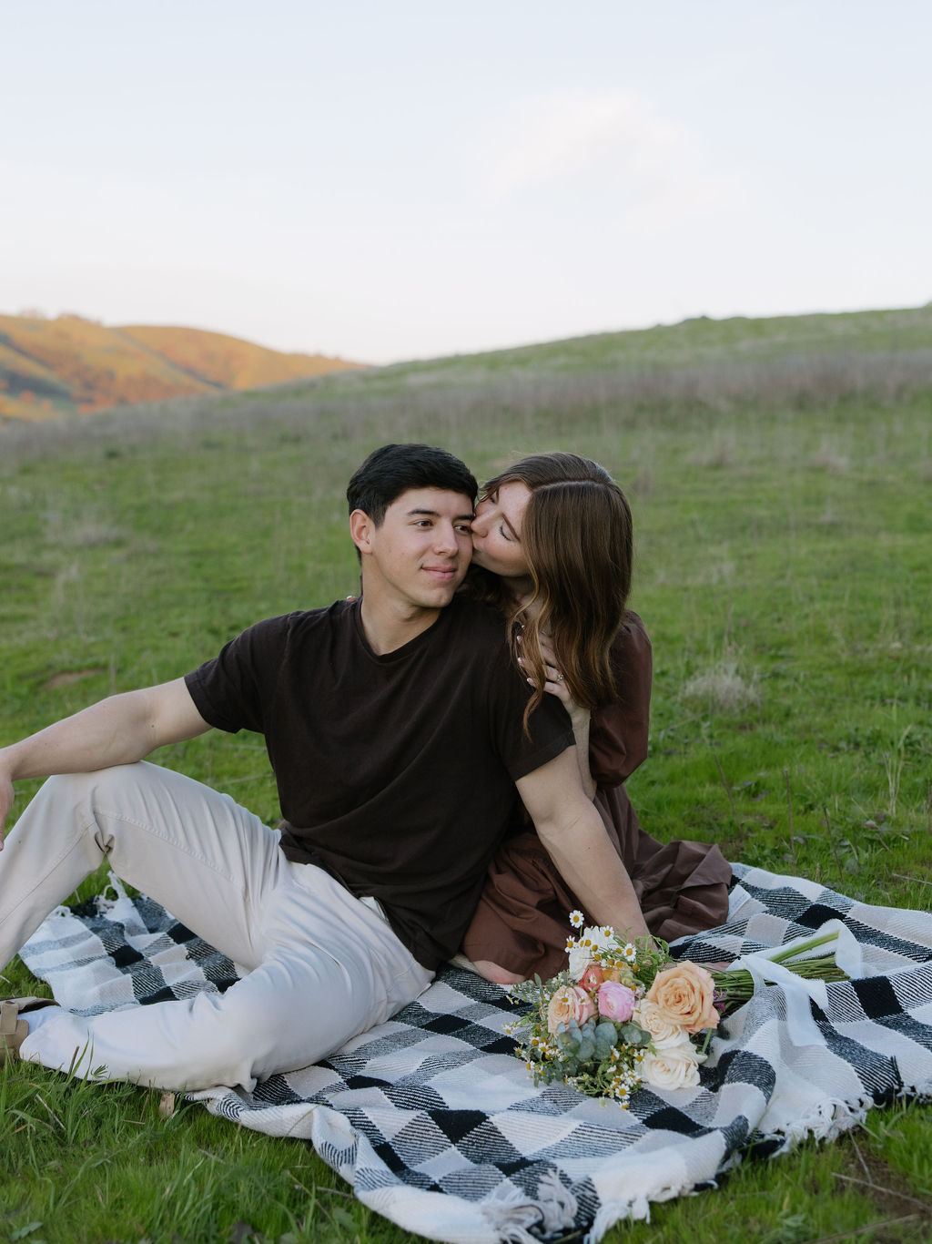 A couple posing for engagement photos in an El Dorado Hills engagement session