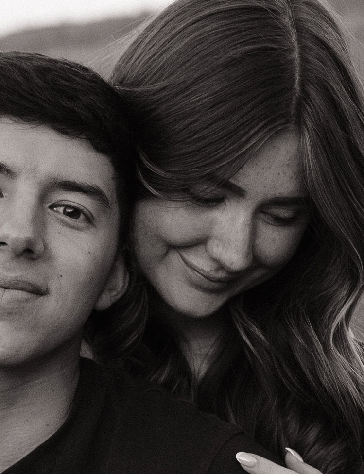 A black and white photo of a couple during their engagement photos