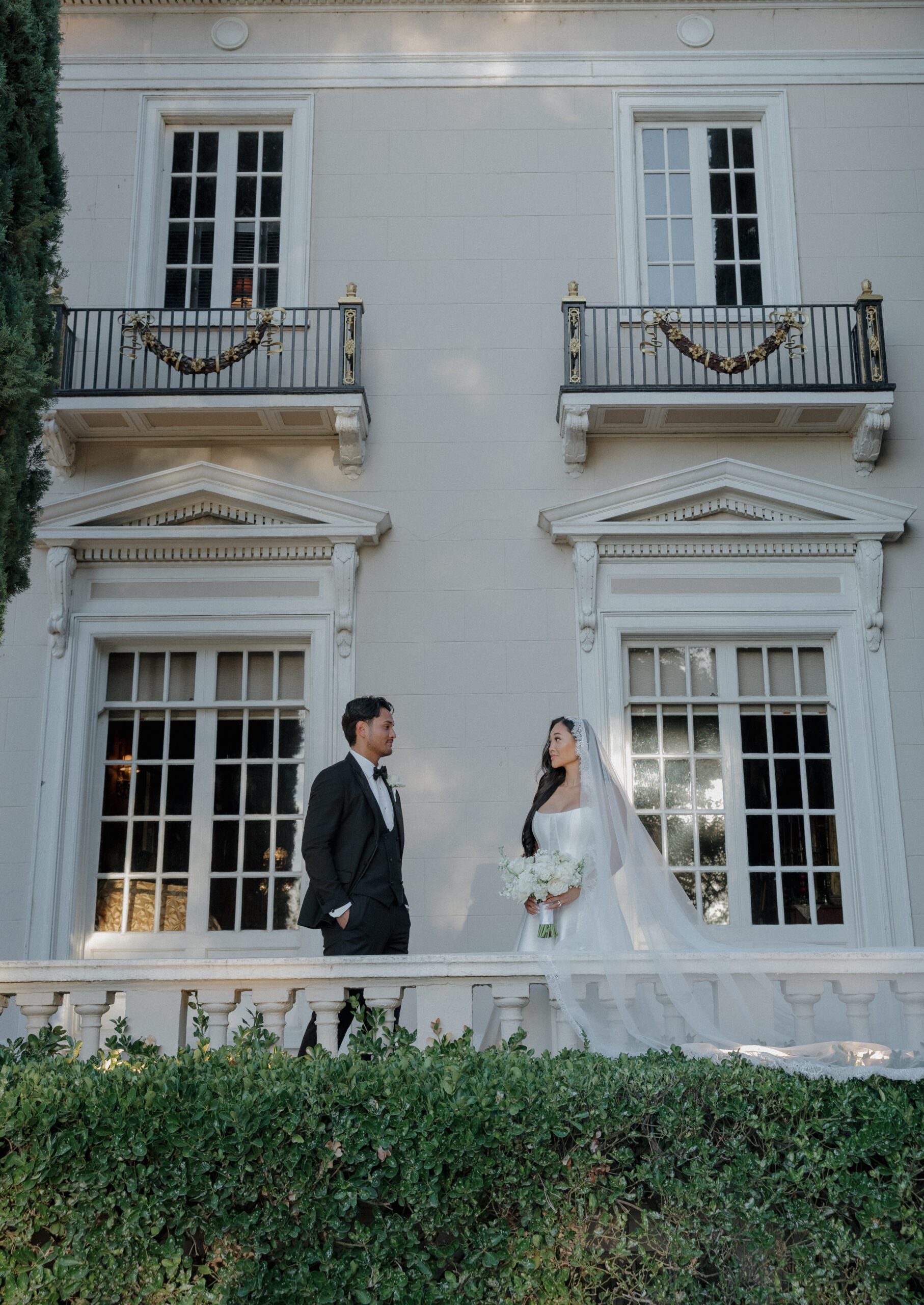 A bride and groom posing for wedding photos at their NorCal wedding venue