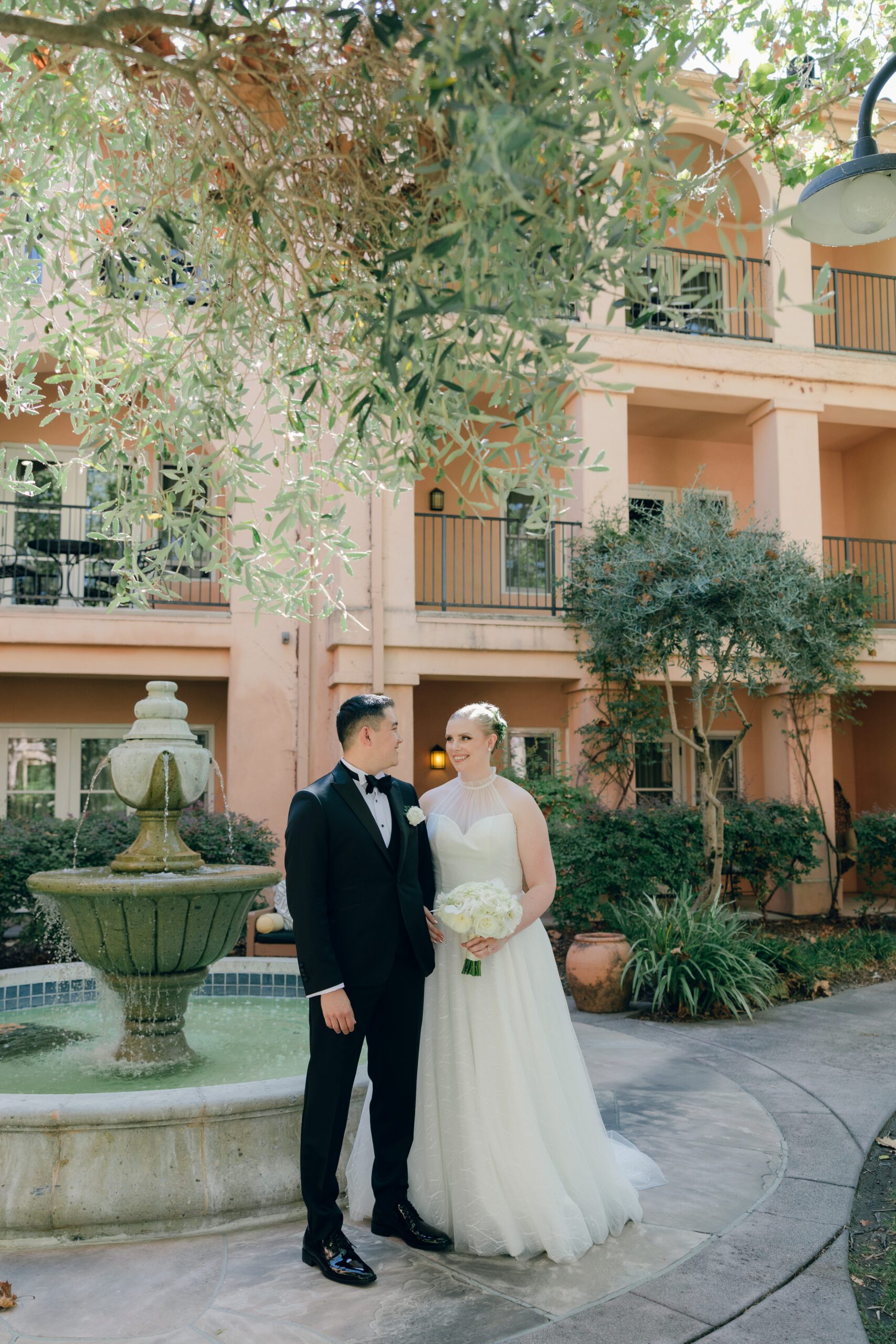 A bride and groom posing for wedding photos in a Northern California wedding location