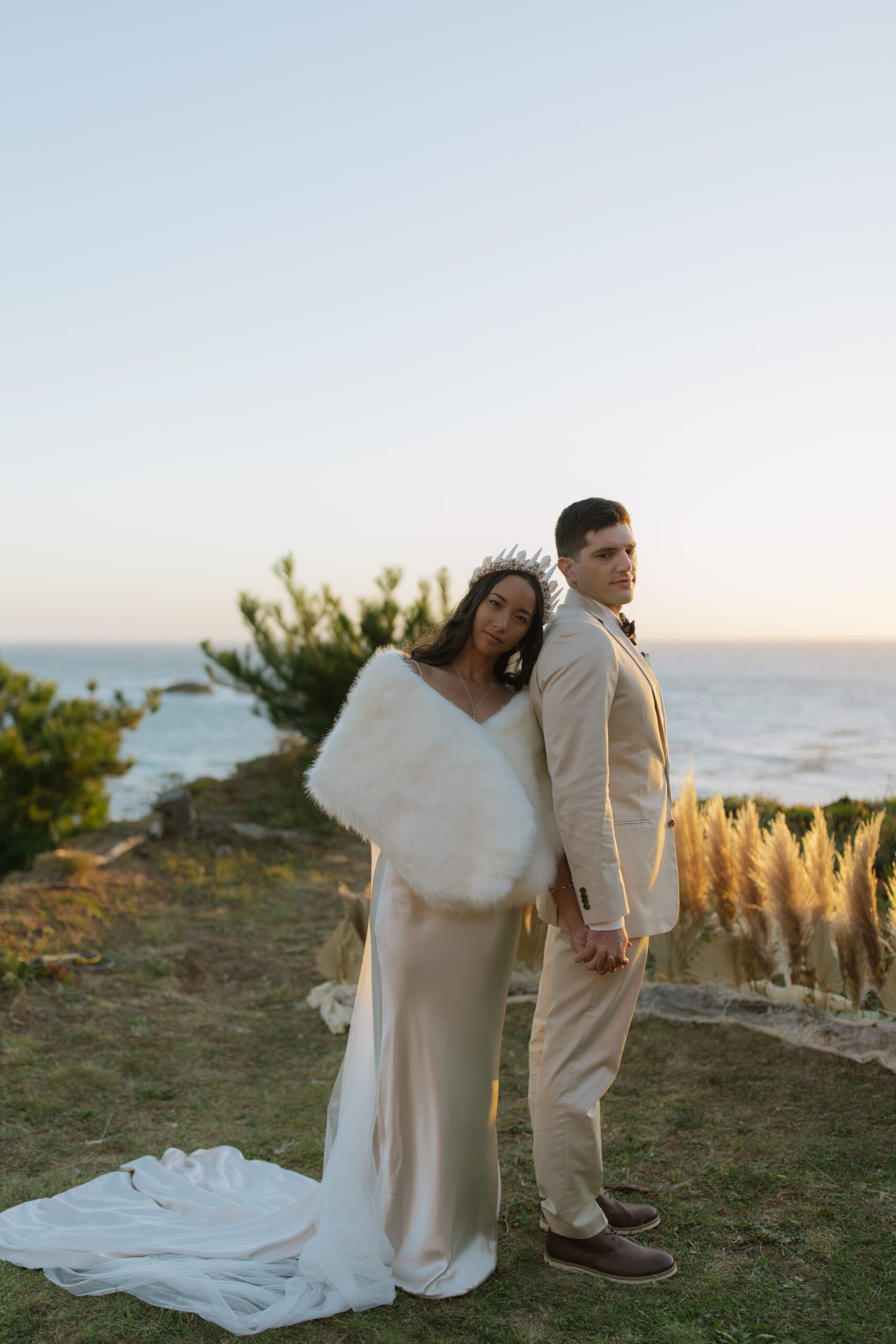 A bride and groom posing for wedding photos at their Bodega Bay wedding
