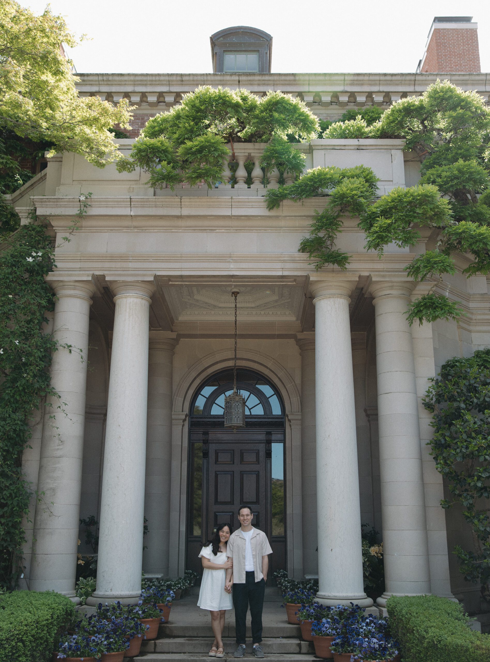 A couple posing for photos at NorCal wedding venue Filoli