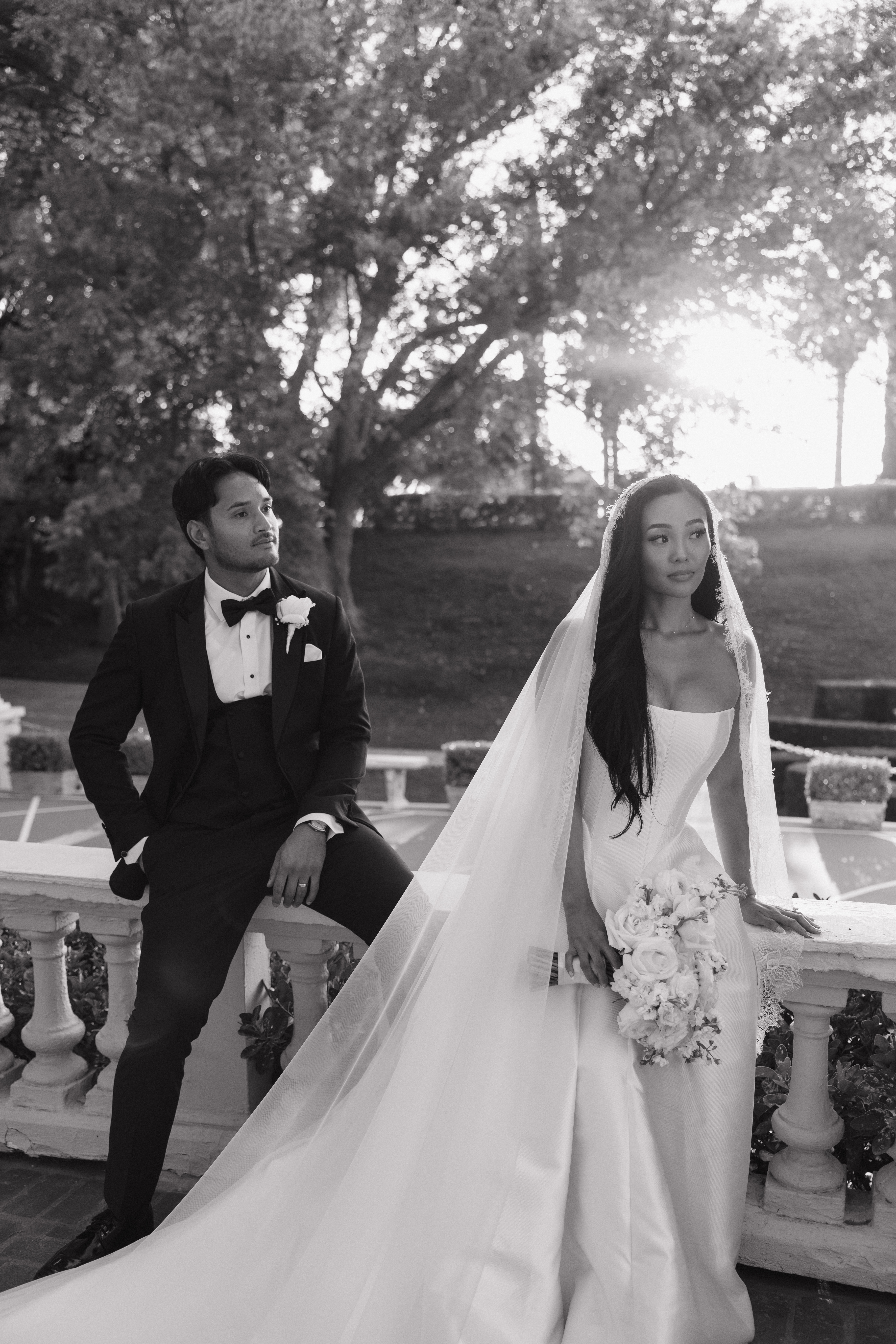 A bride and groom posing for portraits at their NorCal wedding venue, Grand Island mansion