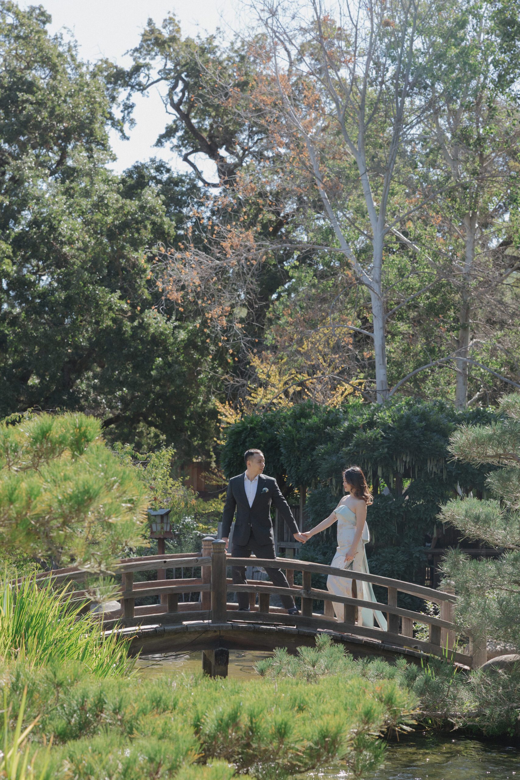 A bride and groom on a bridge at normal wedding venue Hakone estates and gardens