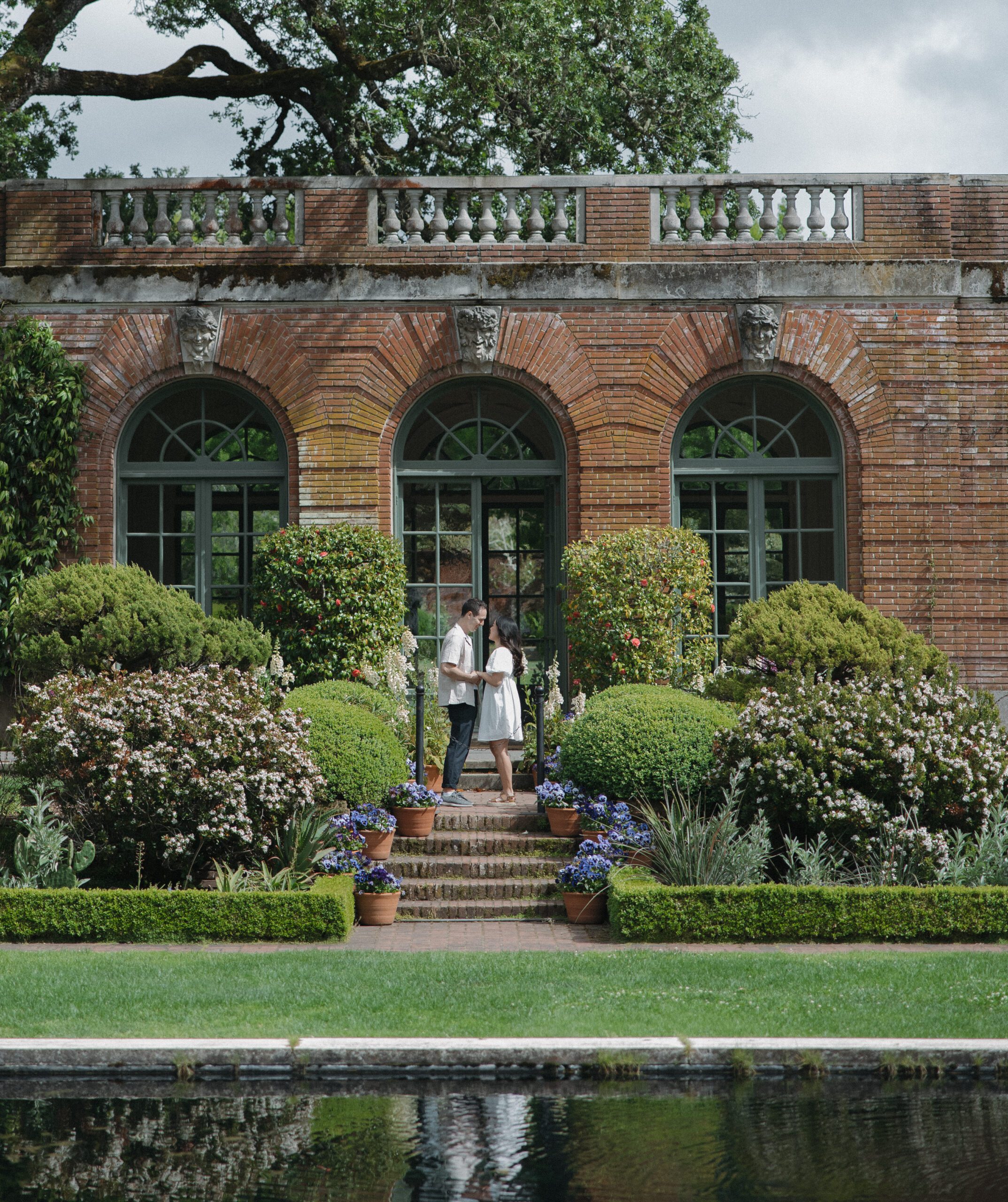 A couple posing for photos at NorCal wedding venue Filoli