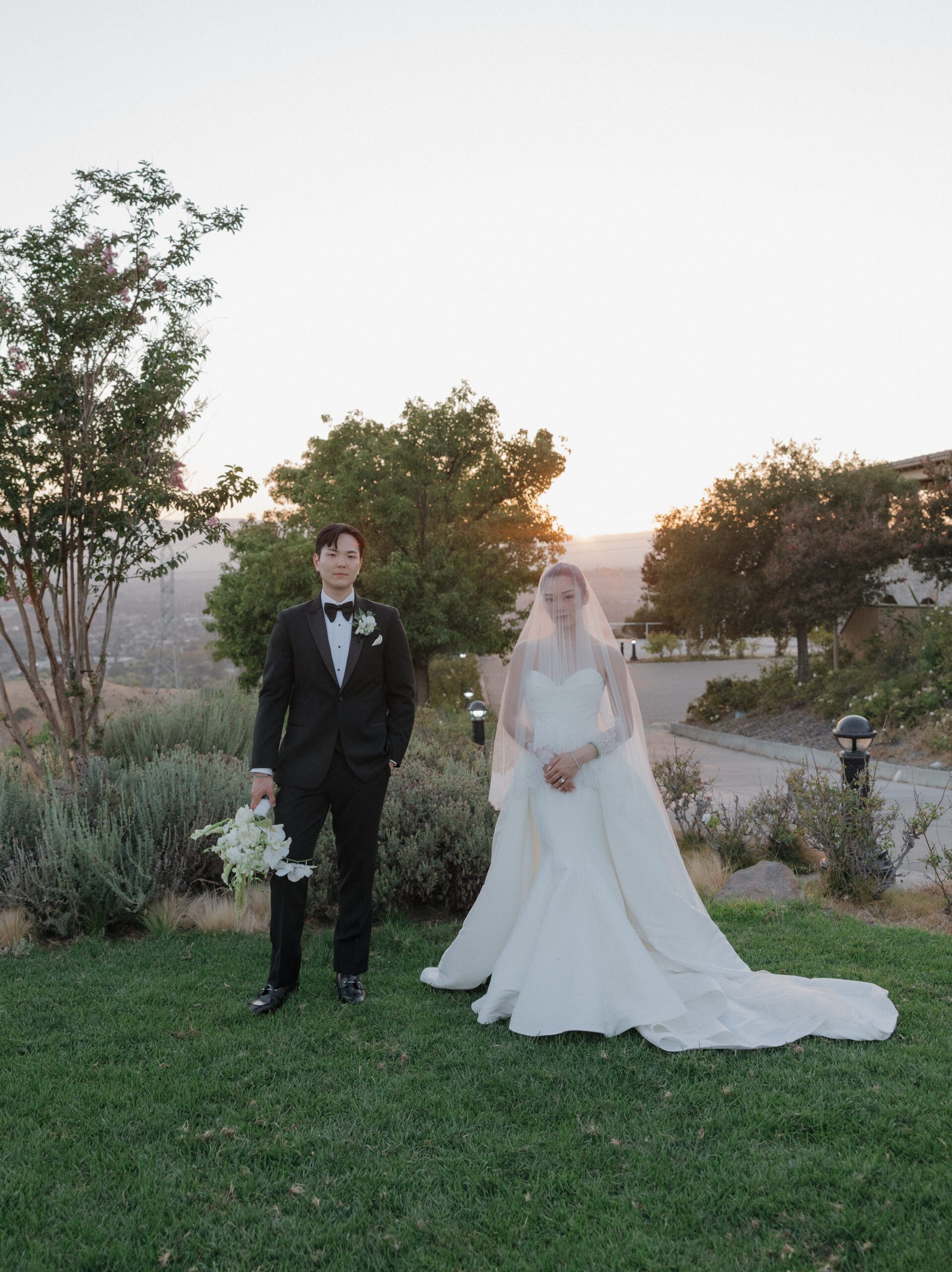 A bride and groom posing for wedding photos at their NorCal wedding venue