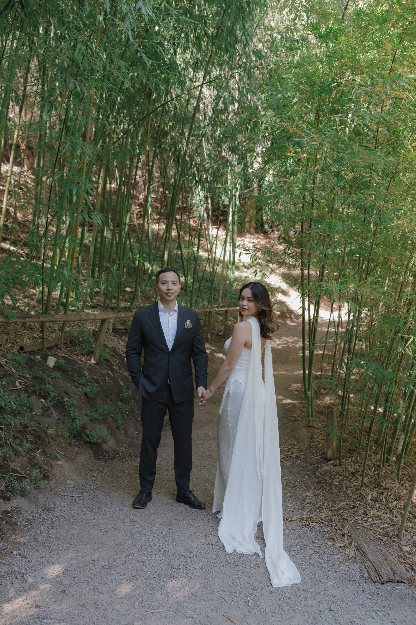 A bride and groom in a bamboo forest in Hakone estate