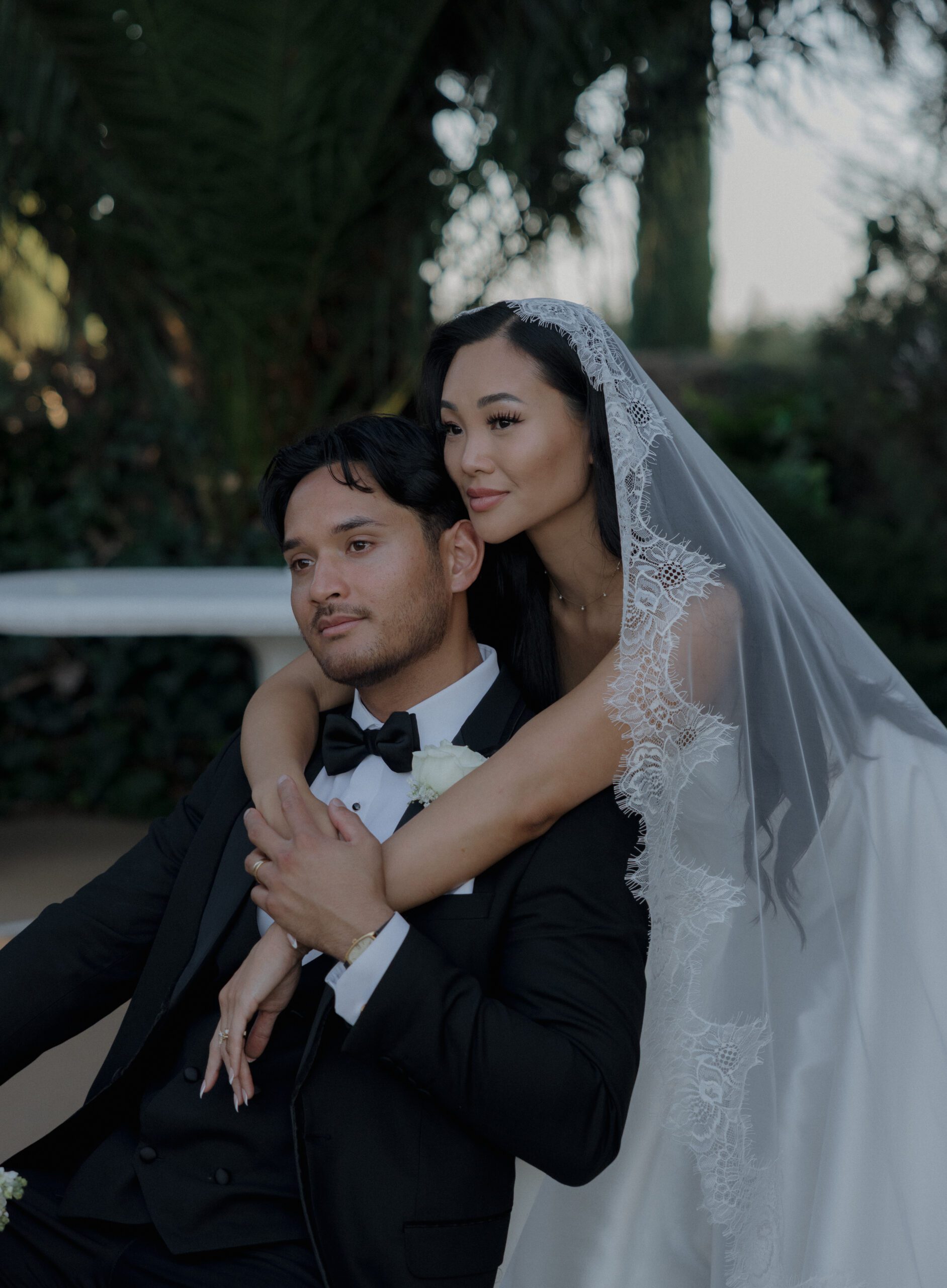 A bride and groom posing for portraits at their NorCal wedding venue, Grand Island mansion