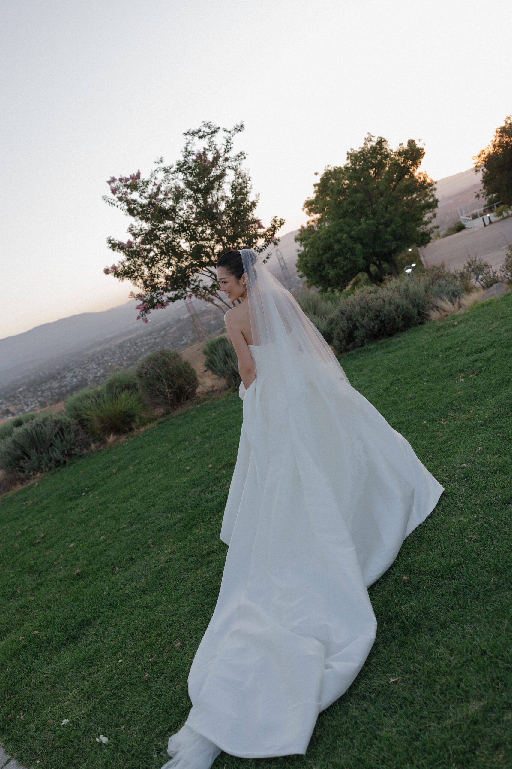 A bride walking on the lawn at the ranch at silver creek