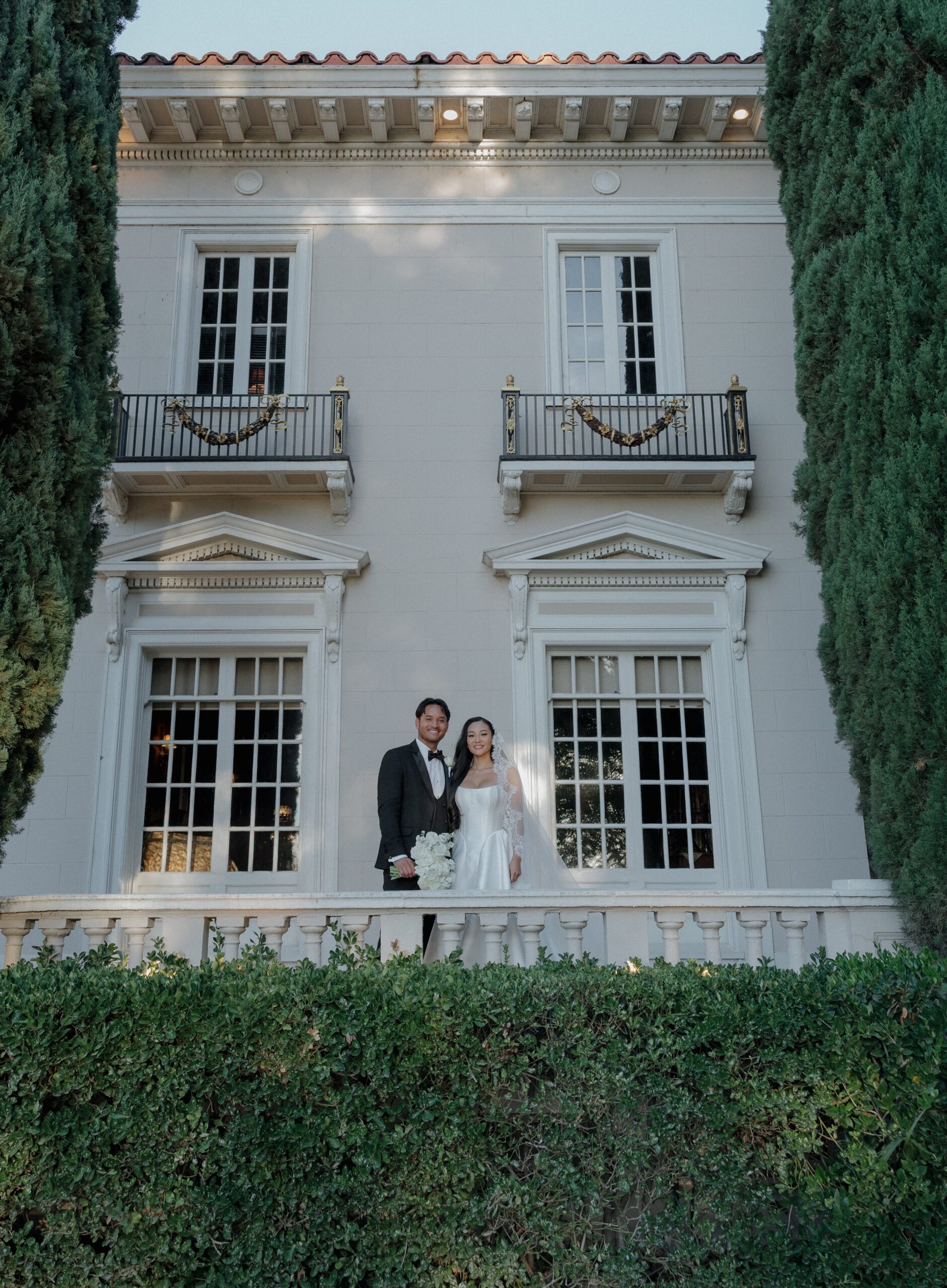 A bride and groom posing for wedding portraits at their NorCal wedding venue grand island mansion