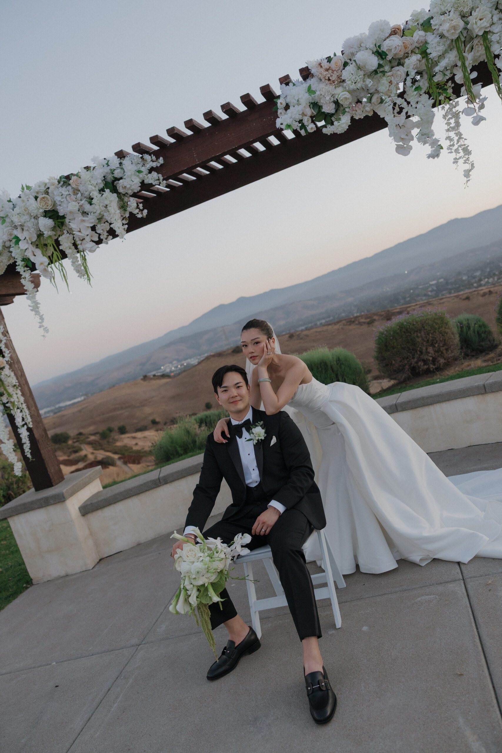 A bride and groom posing for wedding photos at the ranch at silver creek