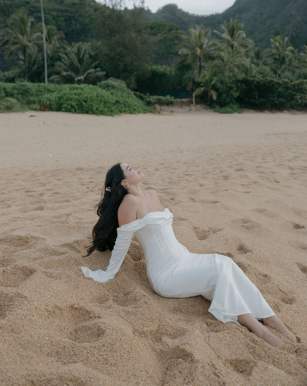 Bridal portraits on the beach from a Hawaii elopement, in a Hawaii elopement dress