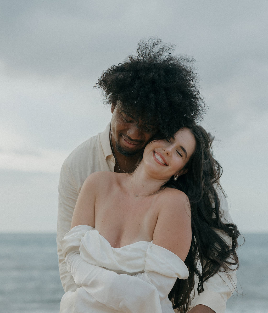 A couple laughing during Kauai elopement photos