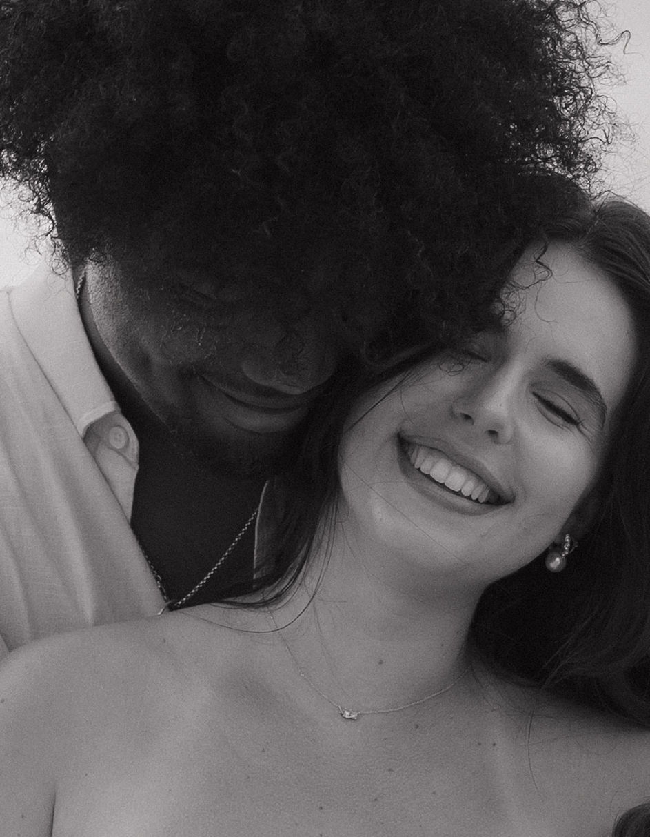 A close up black and white image of a bride and groom at their Kauai elopement