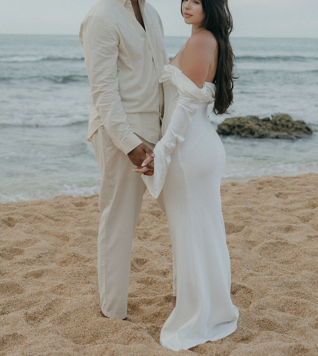 A bride and groom during their Kauai elopement ceremony on Tunnels Beach