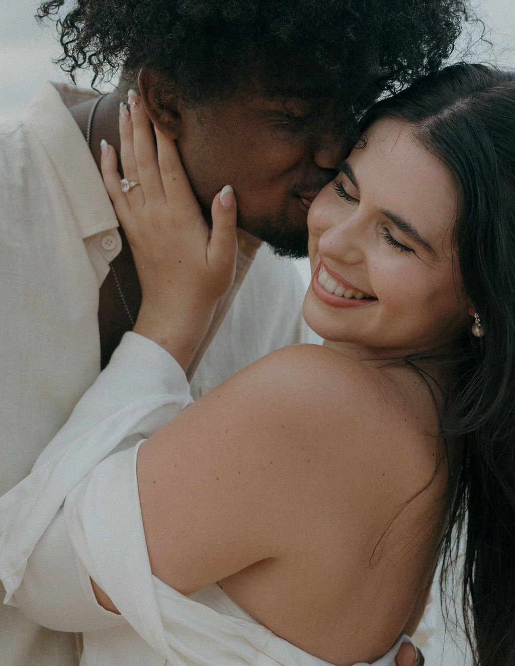 A couple laughing during Kauai elopement photos